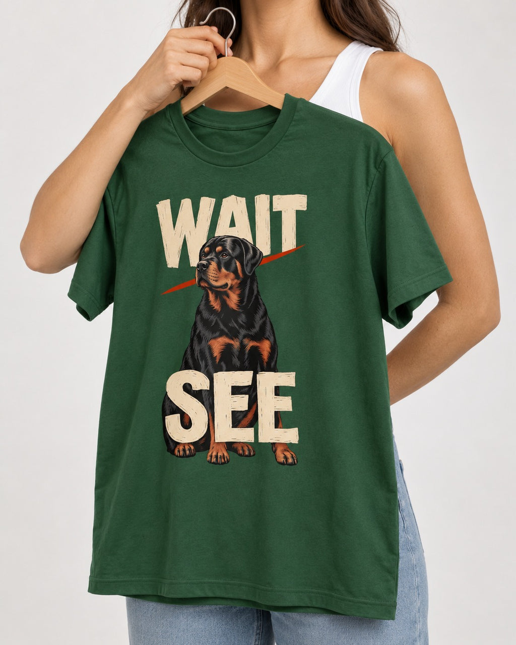 Wait See Rottweiler Seated Slash Graphic T-Shirt in Forest Green, held up on a hanger