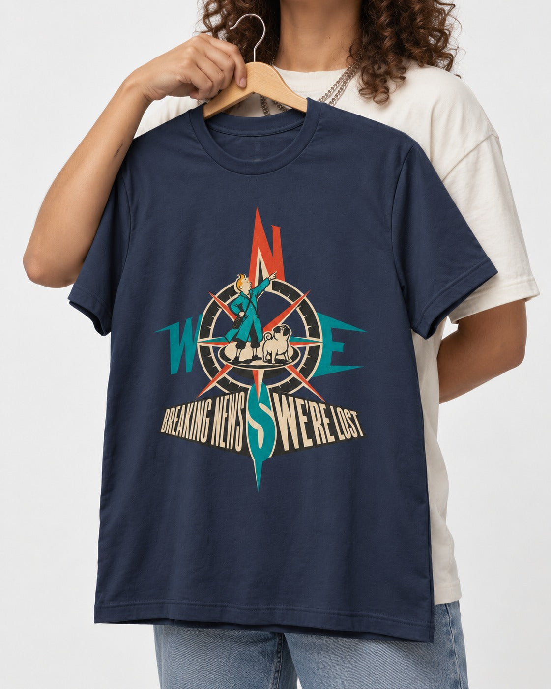 Pug Breaking News We're Lost Compass Graphic T-Shirt in Navy, held up on a hanger