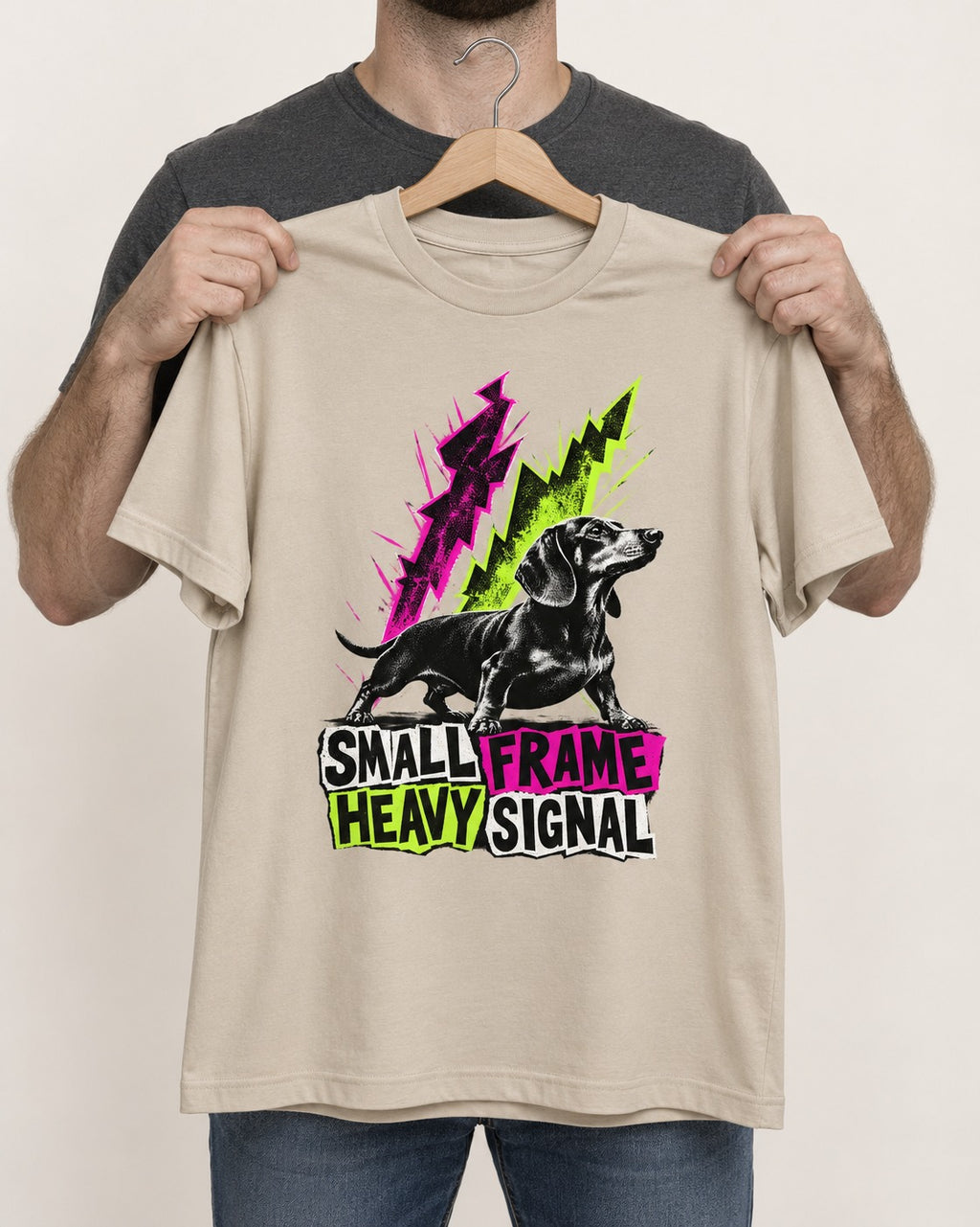 Dachshund Small Frame Heavy Signal T-Shirt in Sand, held up on a hanger