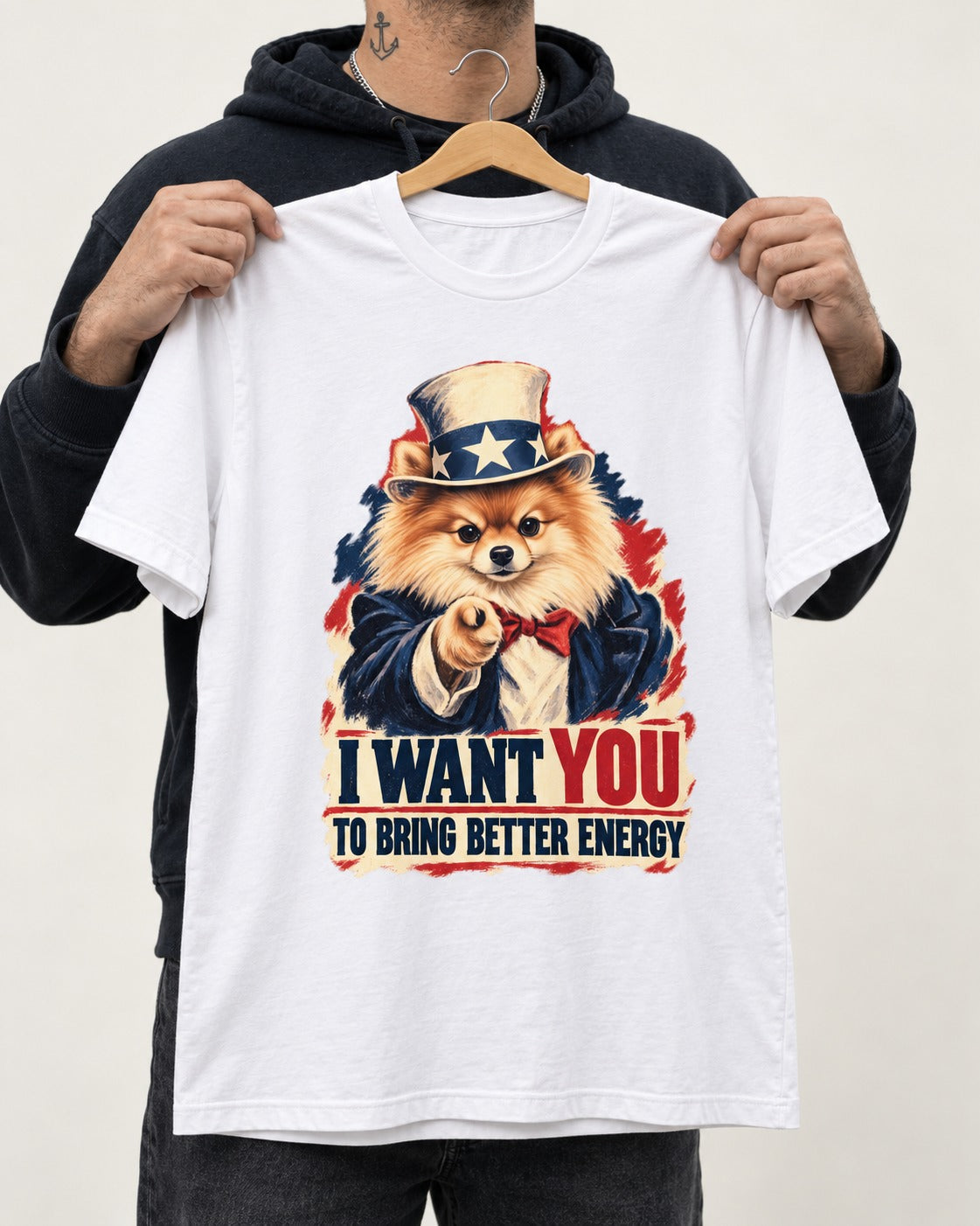 Pomeranian I Want You to Bring Better Energy Uncle Sam Graphic T-Shirt in White, held up on a hanger