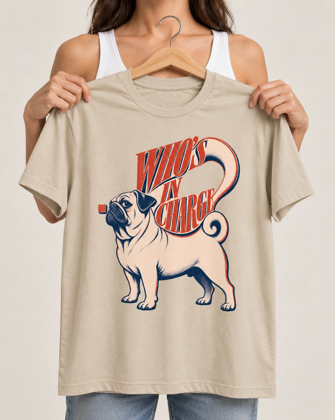 Pug In Charge T-Shirt in Sand, held up on a hanger