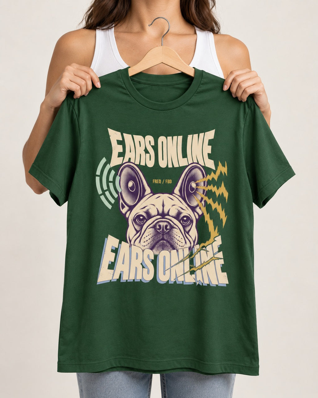 Frenchie Ears Online Audio Signal Graphic T-Shirt in Forest Green, held up on a hanger