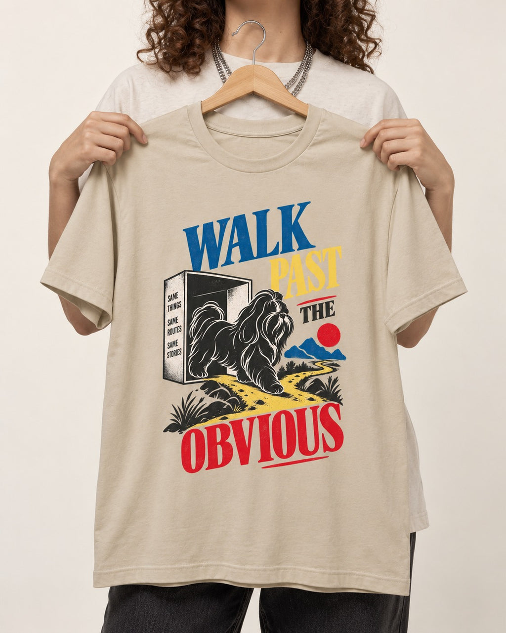 Shih Tzu Walk Past the Obvious T-Shirt in Sand, held up on a hanger