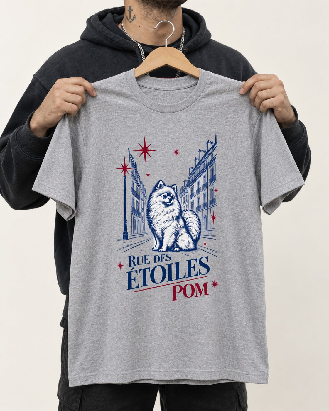 Pomeranian Among the Stars T-Shirt in Sport Grey, held up on a hanger