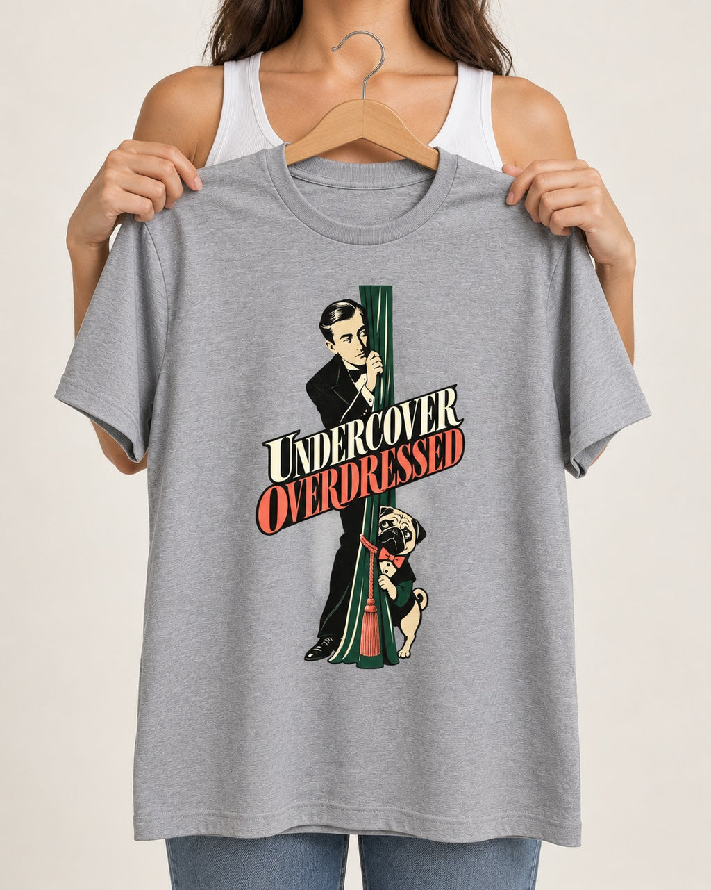 Undercover Overdressed Pug T-Shirt in Sport Grey, held up on a hanger