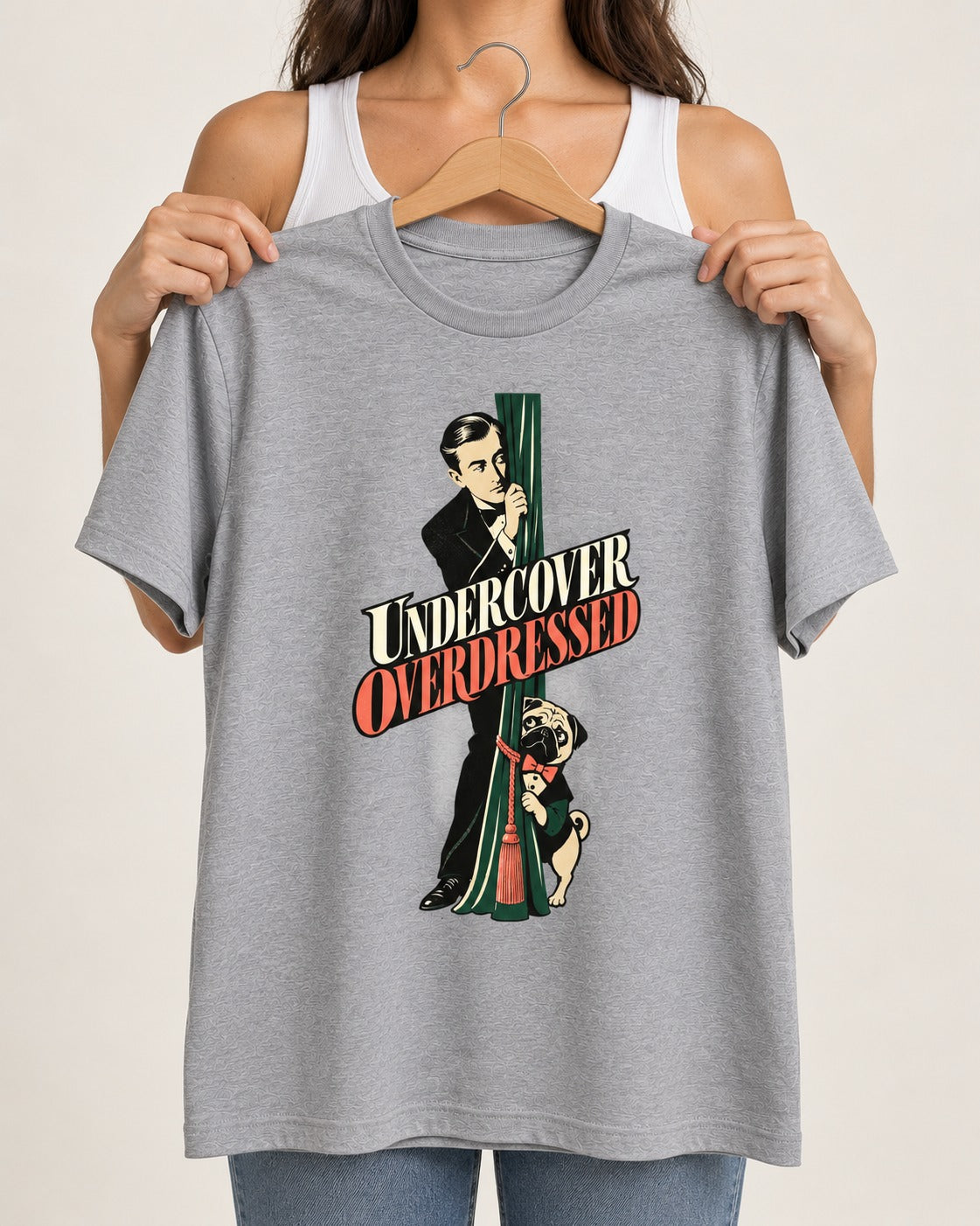 Undercover Overdressed Pug T-Shirt in Sport Grey, held up on a hanger