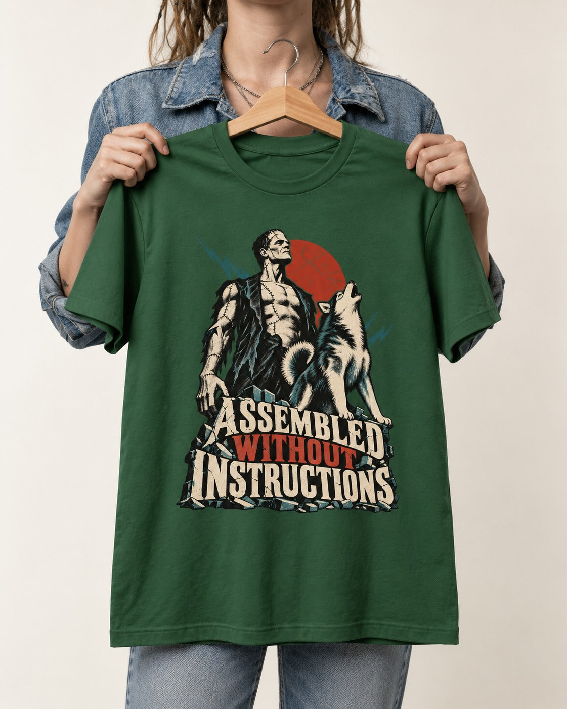 Husky Assembled Without Instructions Frankenstein Graphic T-Shirt in Forest Green, held up on a hanger