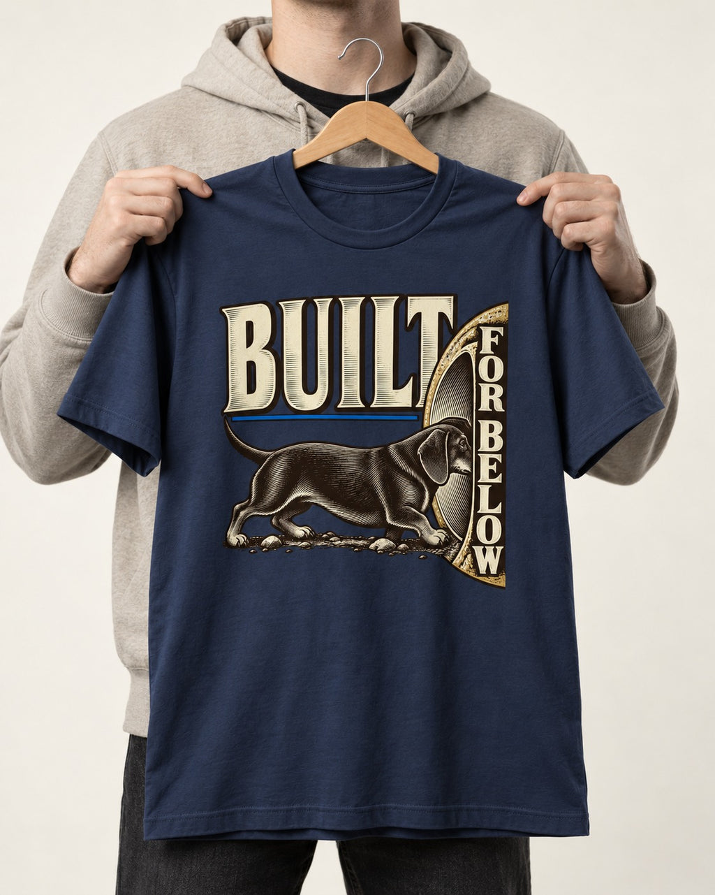 Dachshund Built for Below Vintage Burrow Graphic T-Shirt in Navy, held up on a hanger