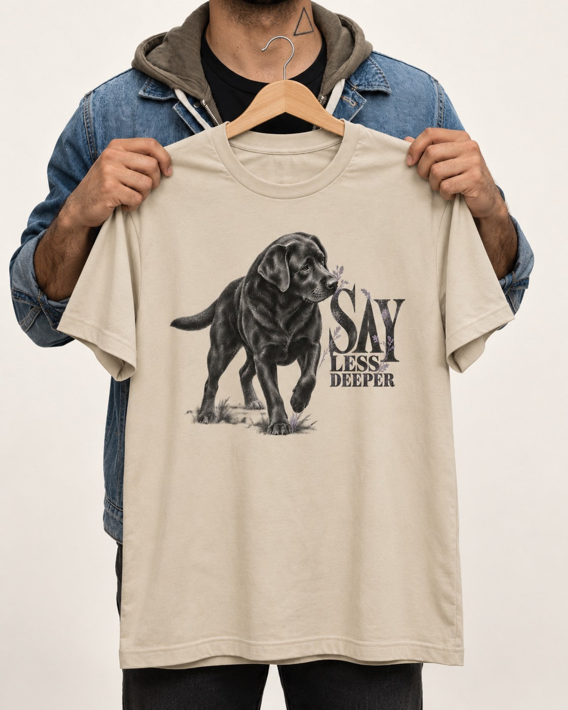 Say Less Deeper Labrador Retriever T-Shirt in Sand, held up on a hanger