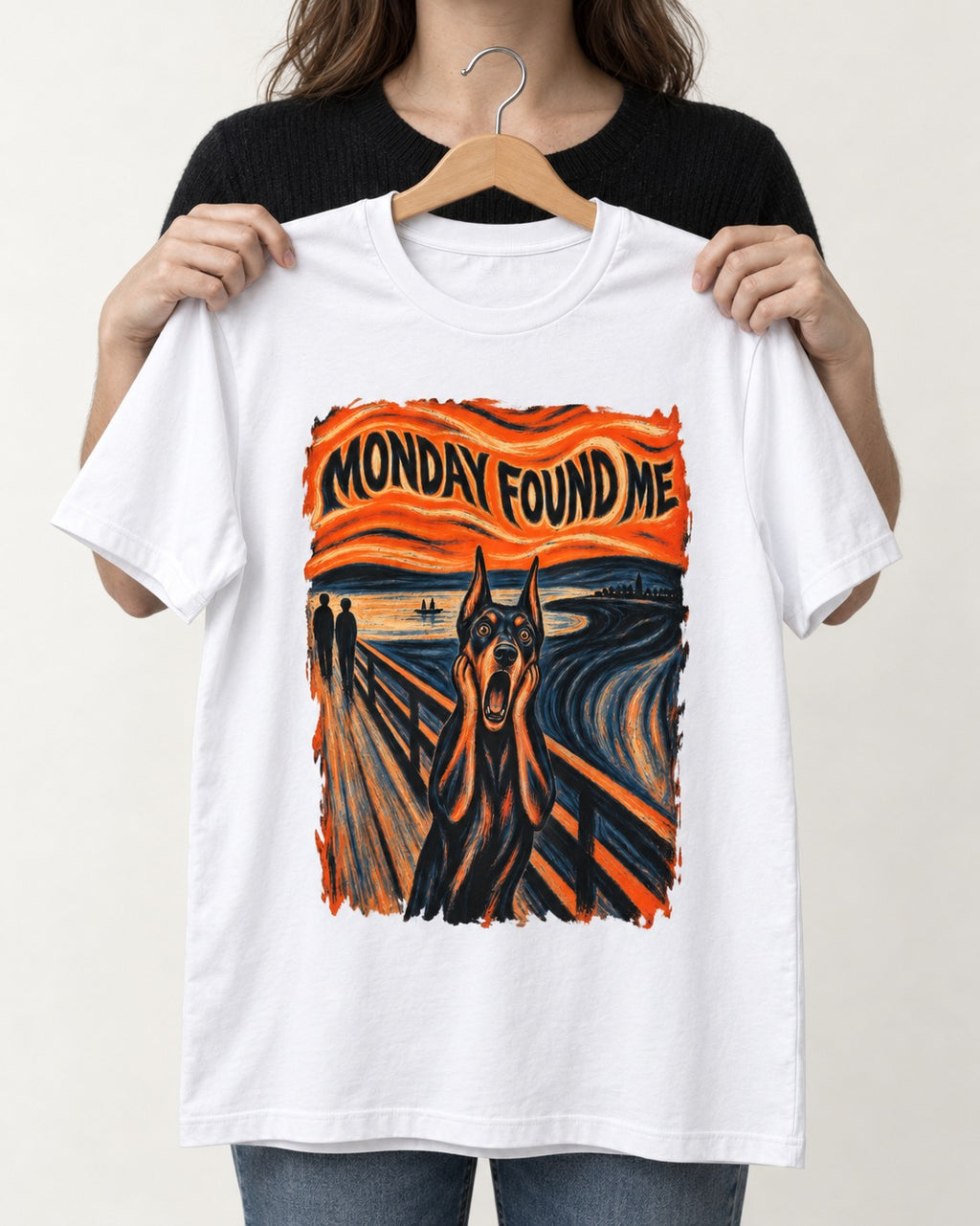Doberman Monday Found Me Scream Graphic T-Shirt in White, held up on a hanger