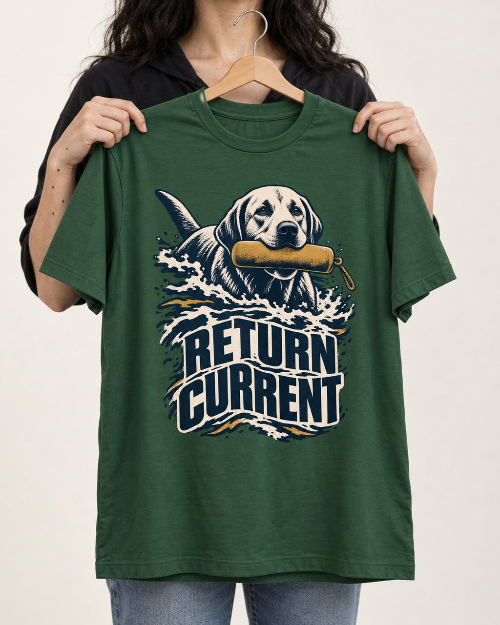 Return Current Water Retrieve Labrador Retriever Graphic T-Shirt in Forest Green, held up on a hanger