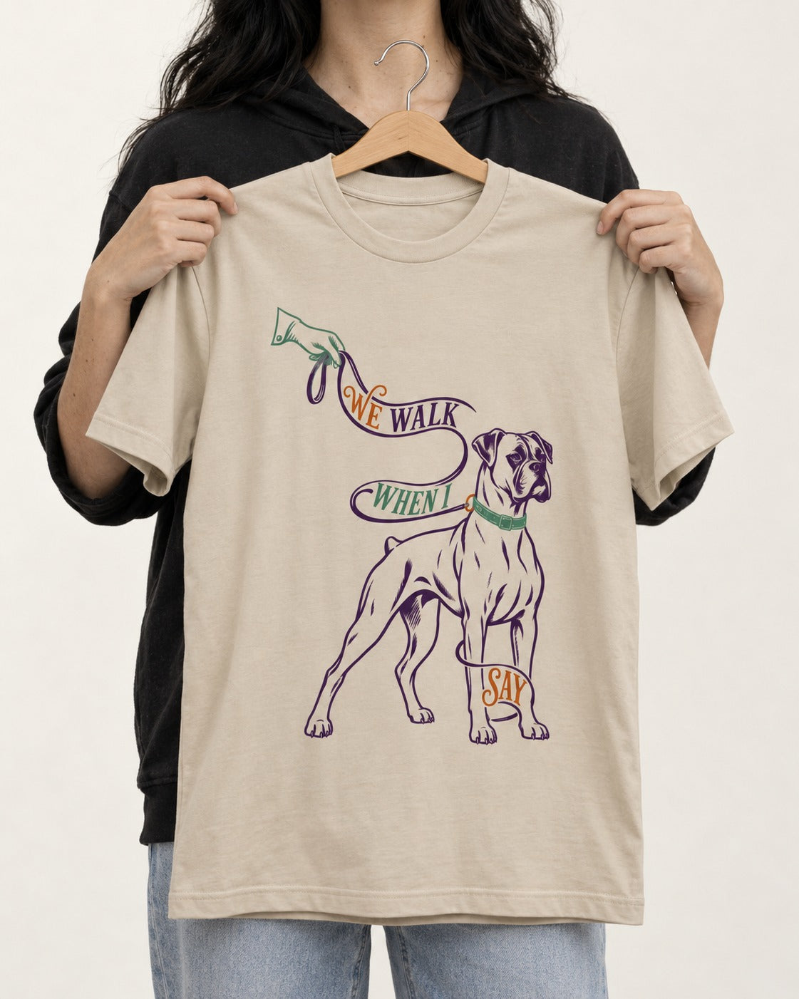 Boxer When I Say T-Shirt in Sand, held up on a hanger