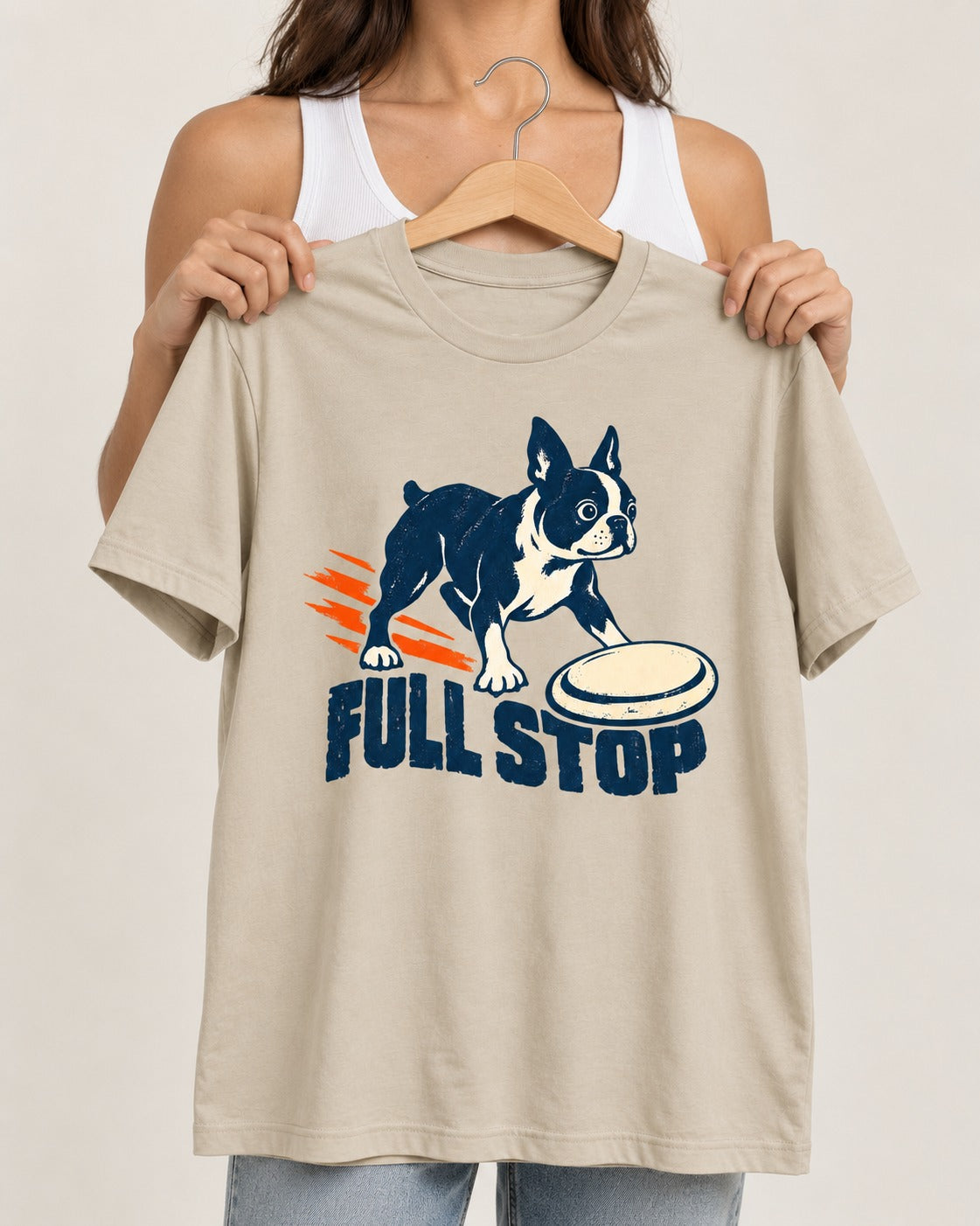 Boston Terrier Full Stop T-Shirt in Sand, held up on a hanger