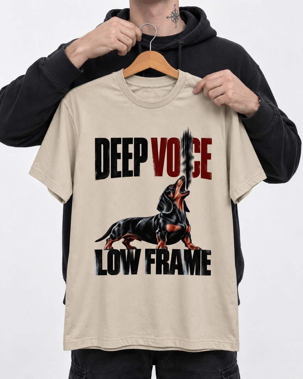 Deep Voice Low Frame Dachshund T-Shirt in Sand, held up on a hanger