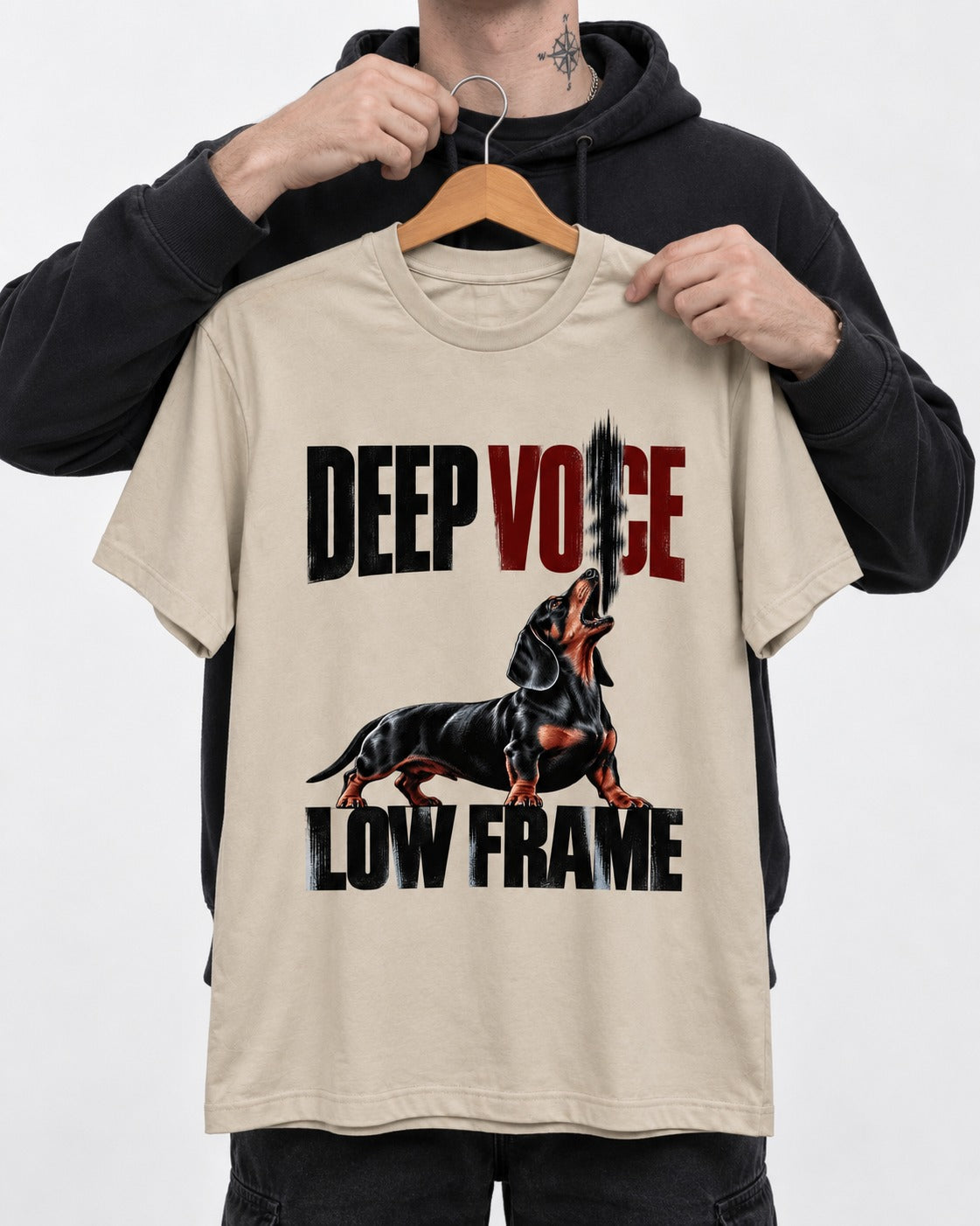 Deep Voice Low Frame Dachshund T-Shirt in Sand, held up on a hanger