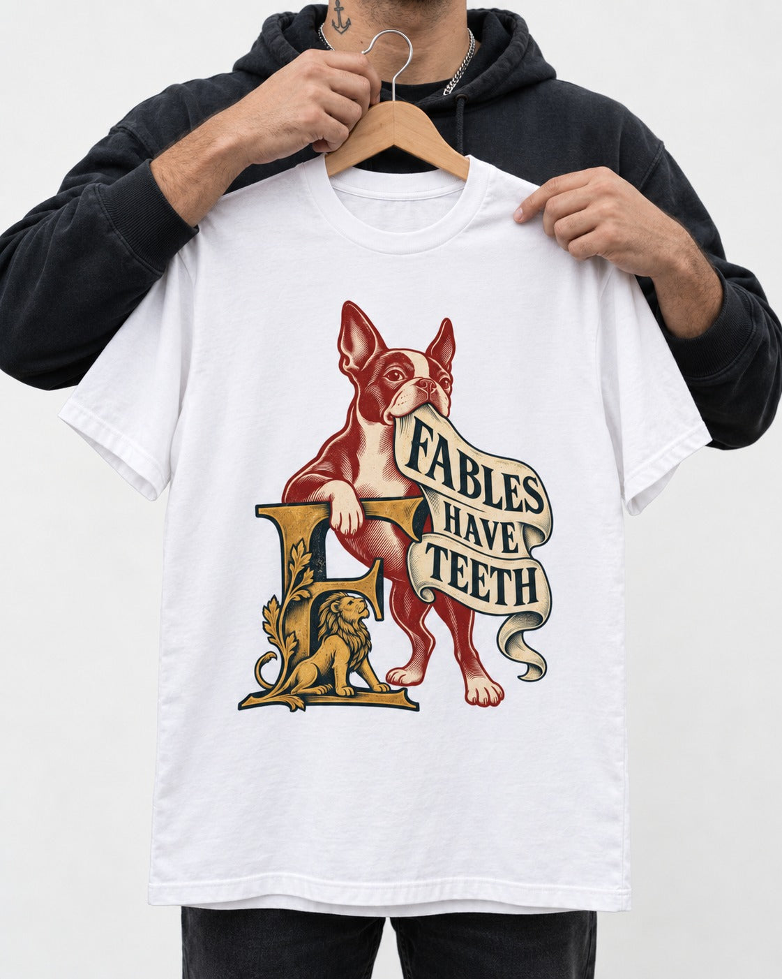 Boston Terrier Fables Have Teeth T-Shirt in White, held up on a hanger