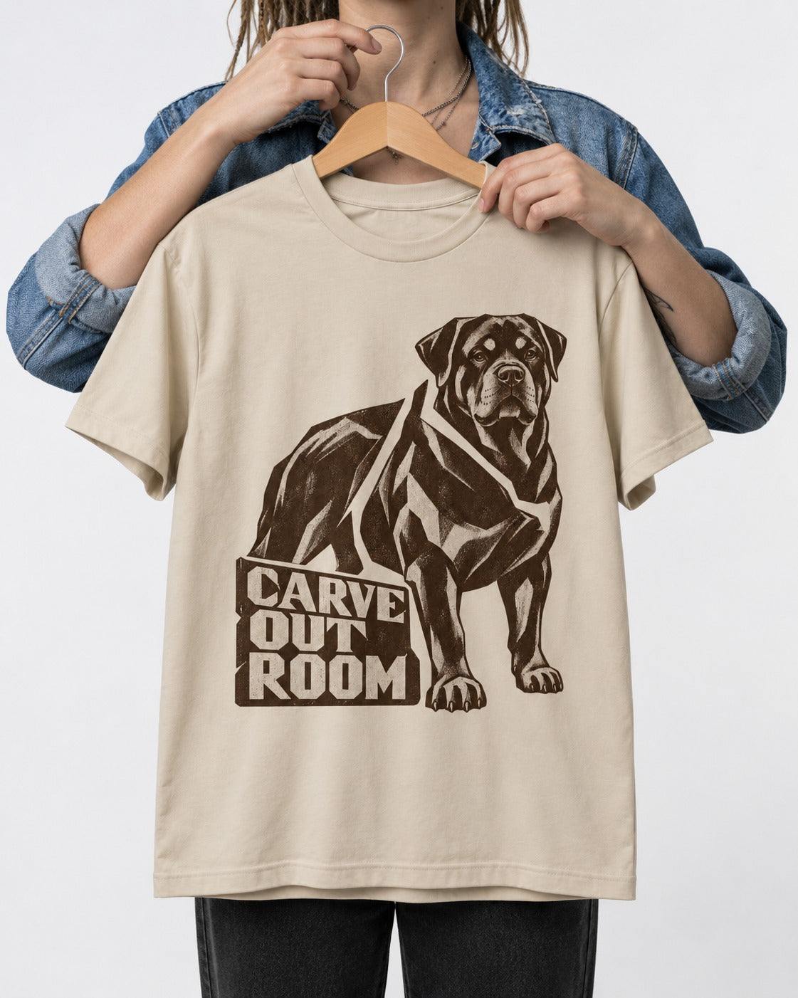 Carve Out Room for Rottweiler T-Shirt in Sand, held up on a hanger