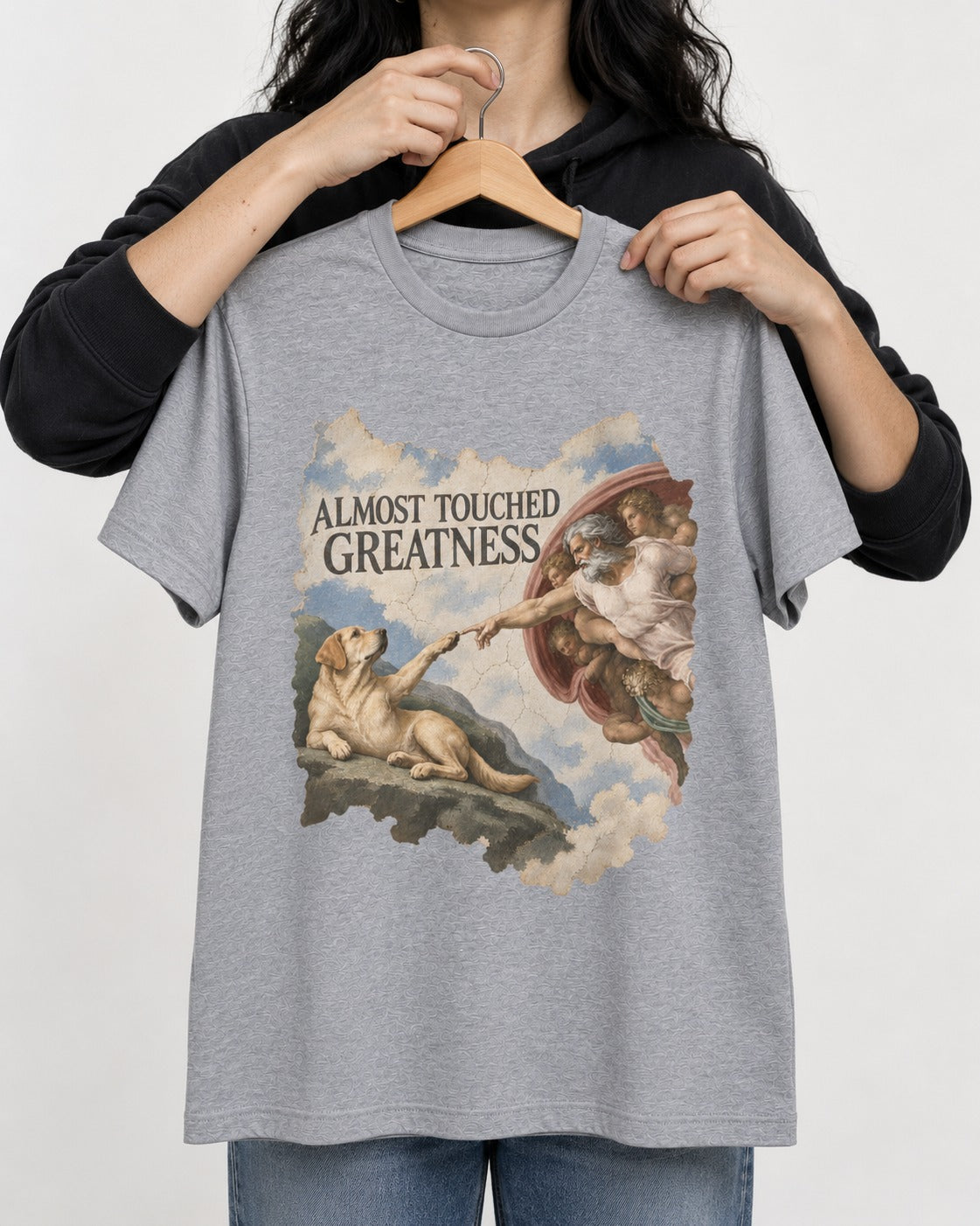 Labrador Retriever Almost Touched Greatness T-Shirt in Sport Grey, held up on a hanger