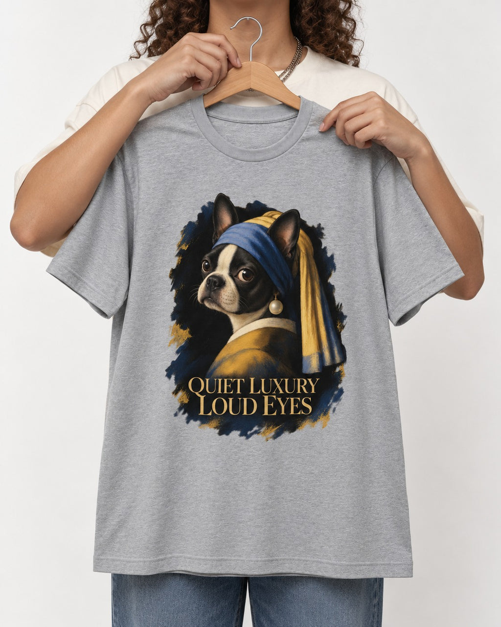 Quiet Luxury Loud Eyes Boston Terrier Pearl Portrait T-Shirt in Sport Grey, held up on a hanger