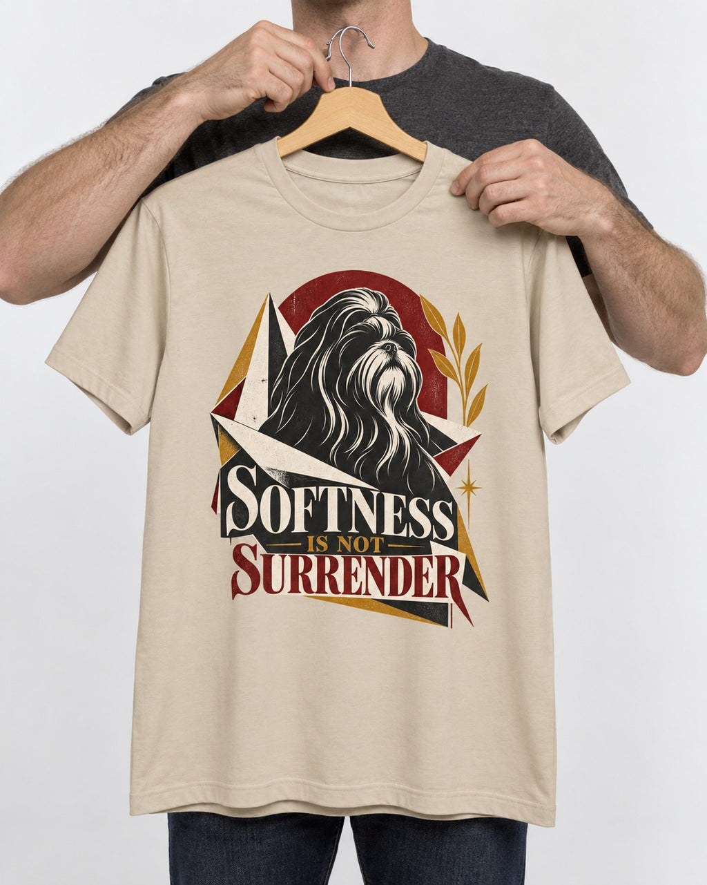 Shih Tzu Softness Is Not Surrender T-Shirt in Sand, held up on a hanger