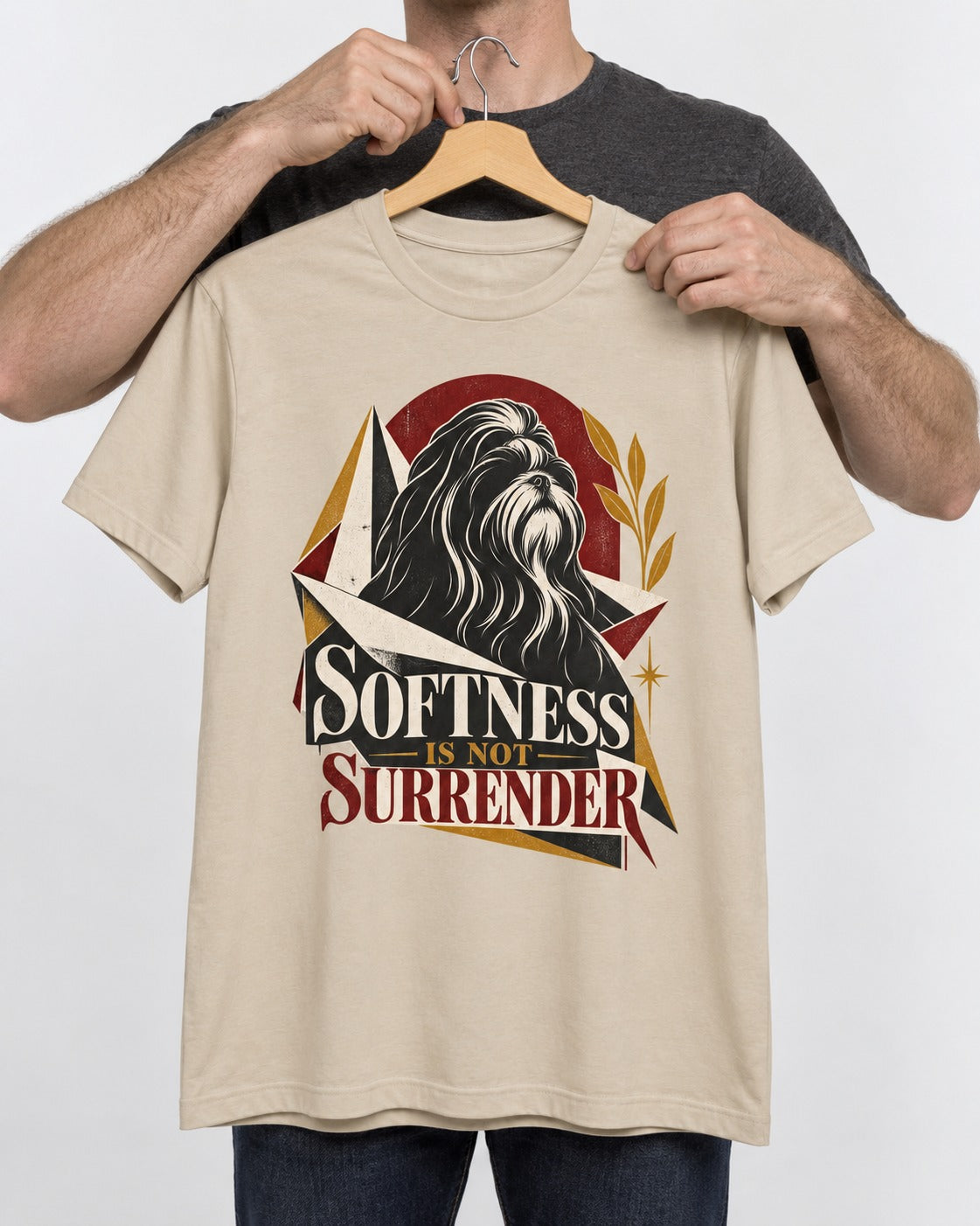 Shih Tzu Softness Is Not Surrender T-Shirt in Sand, held up on a hanger