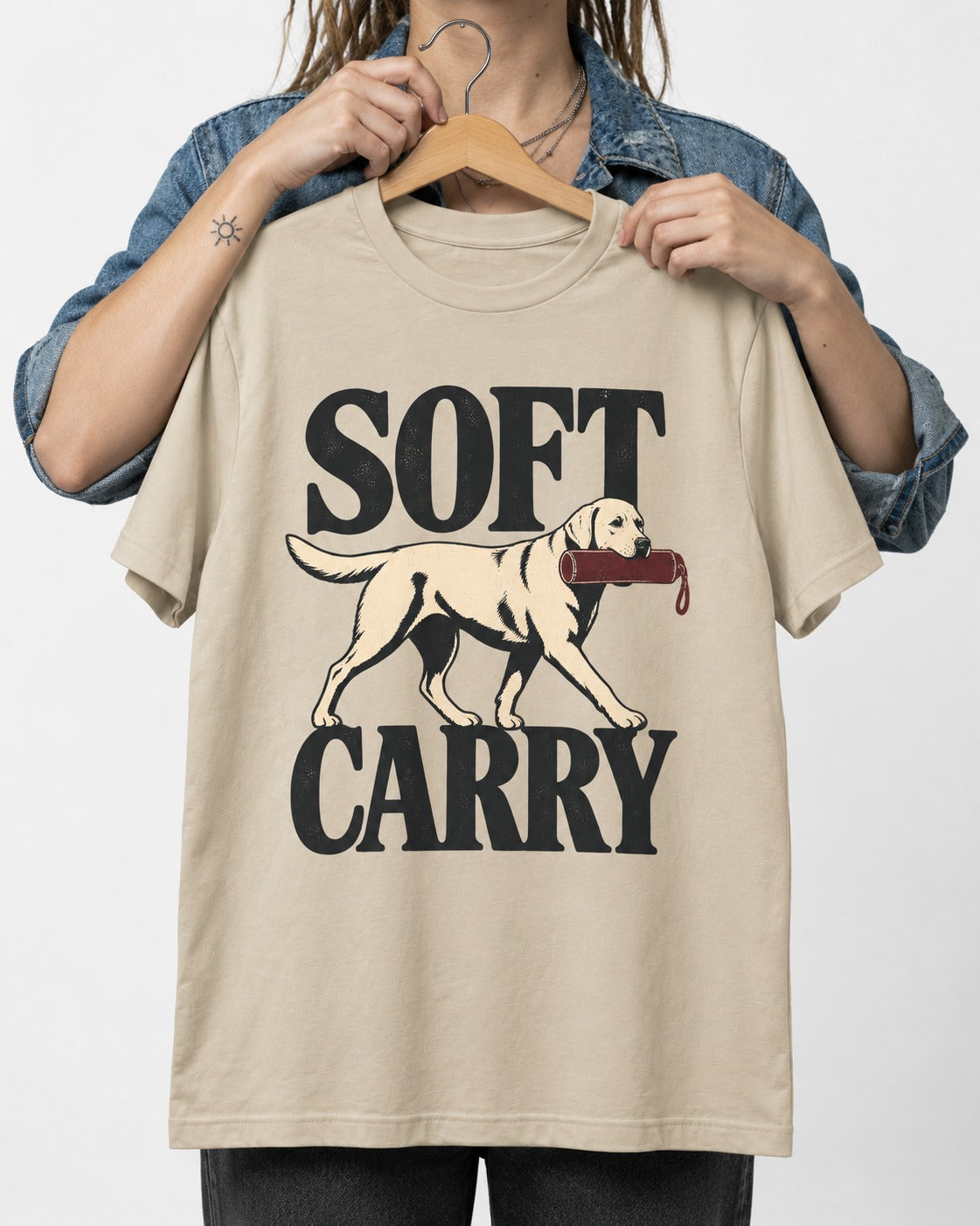 Soft Carry Labrador Retriever T-Shirt in Sand, held up on a hanger