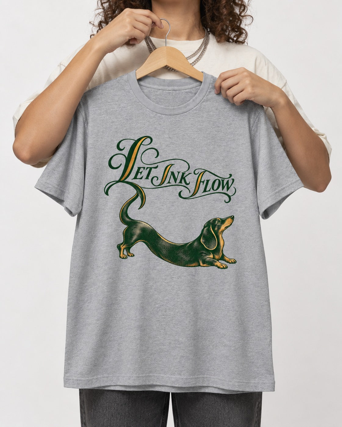 Let the Dachshund Ink Flow T-Shirt in Sport Grey, held up on a hanger