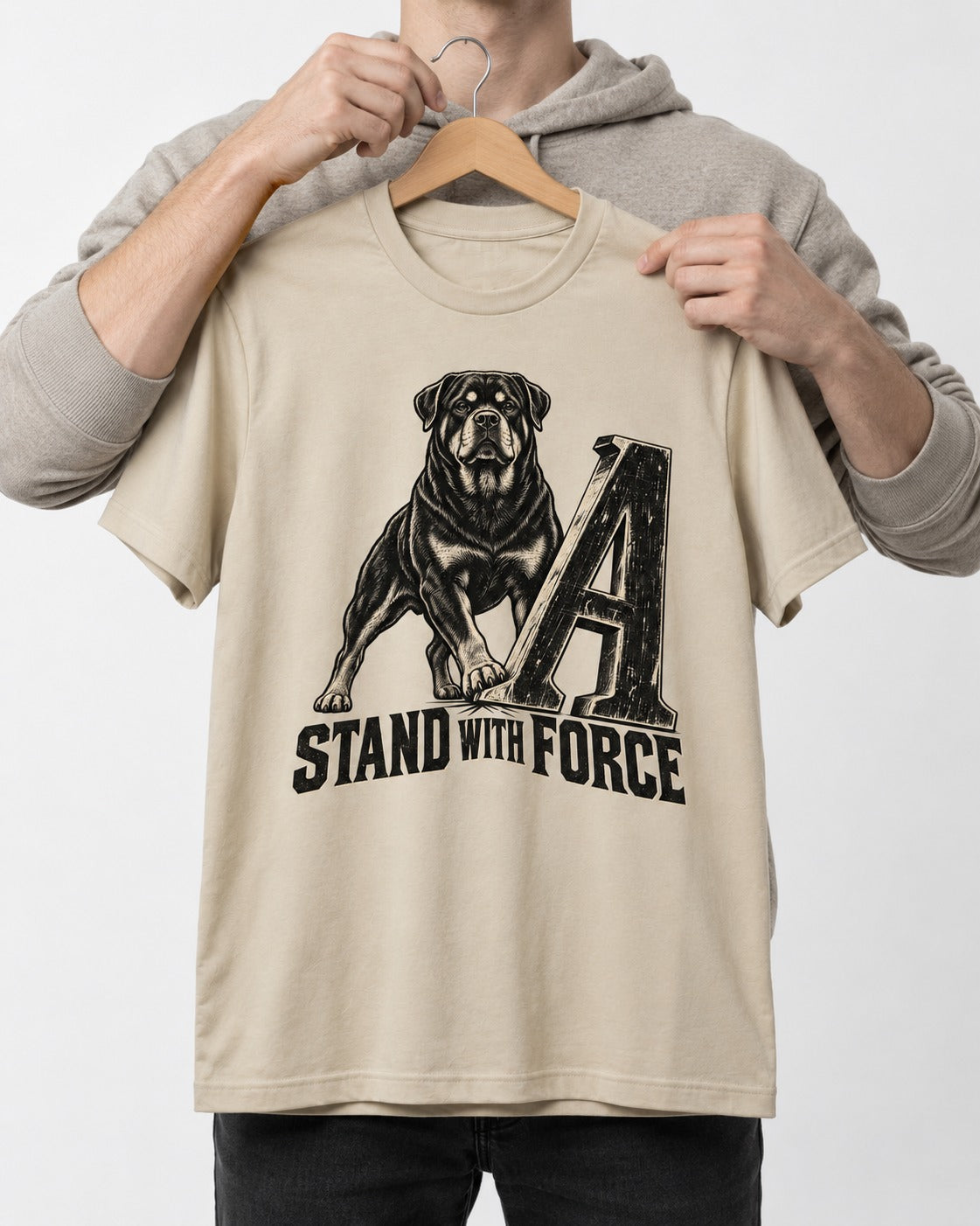Rottweiler Stand with Force T-Shirt in Sand, held up on a hanger