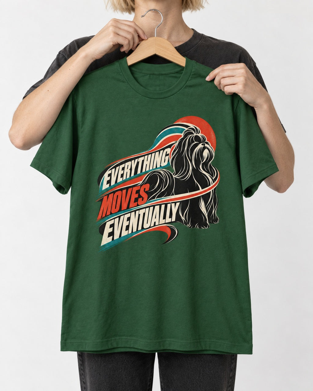 Shih Tzu Everything Moves Eventually Retro Speed Graphic T-Shirt in Forest Green, held up on a hanger