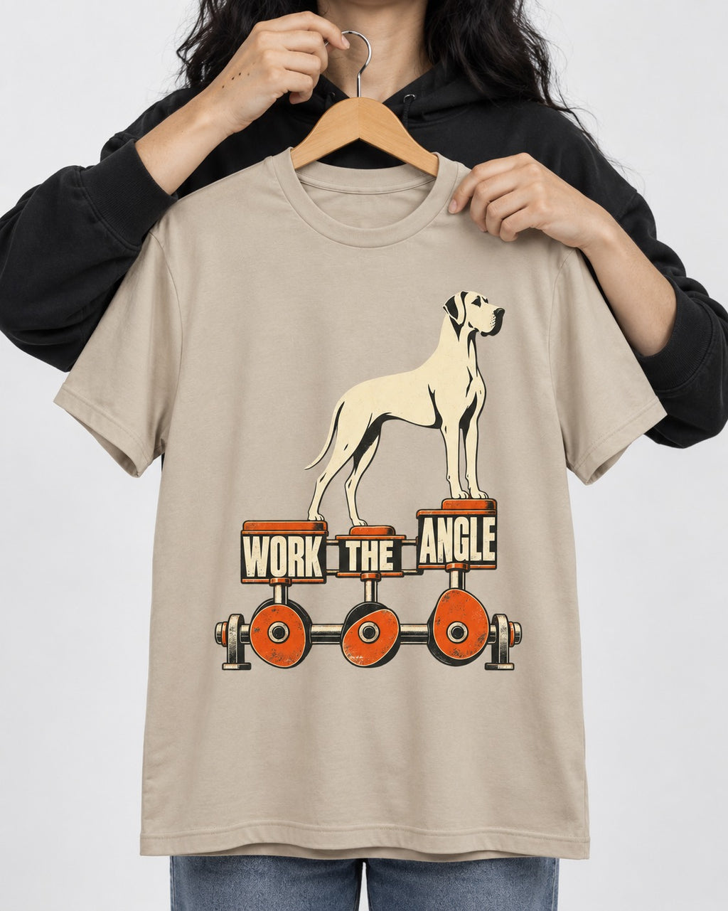 Great Dane Work the Angle T-Shirt in Sand, held up on a hanger