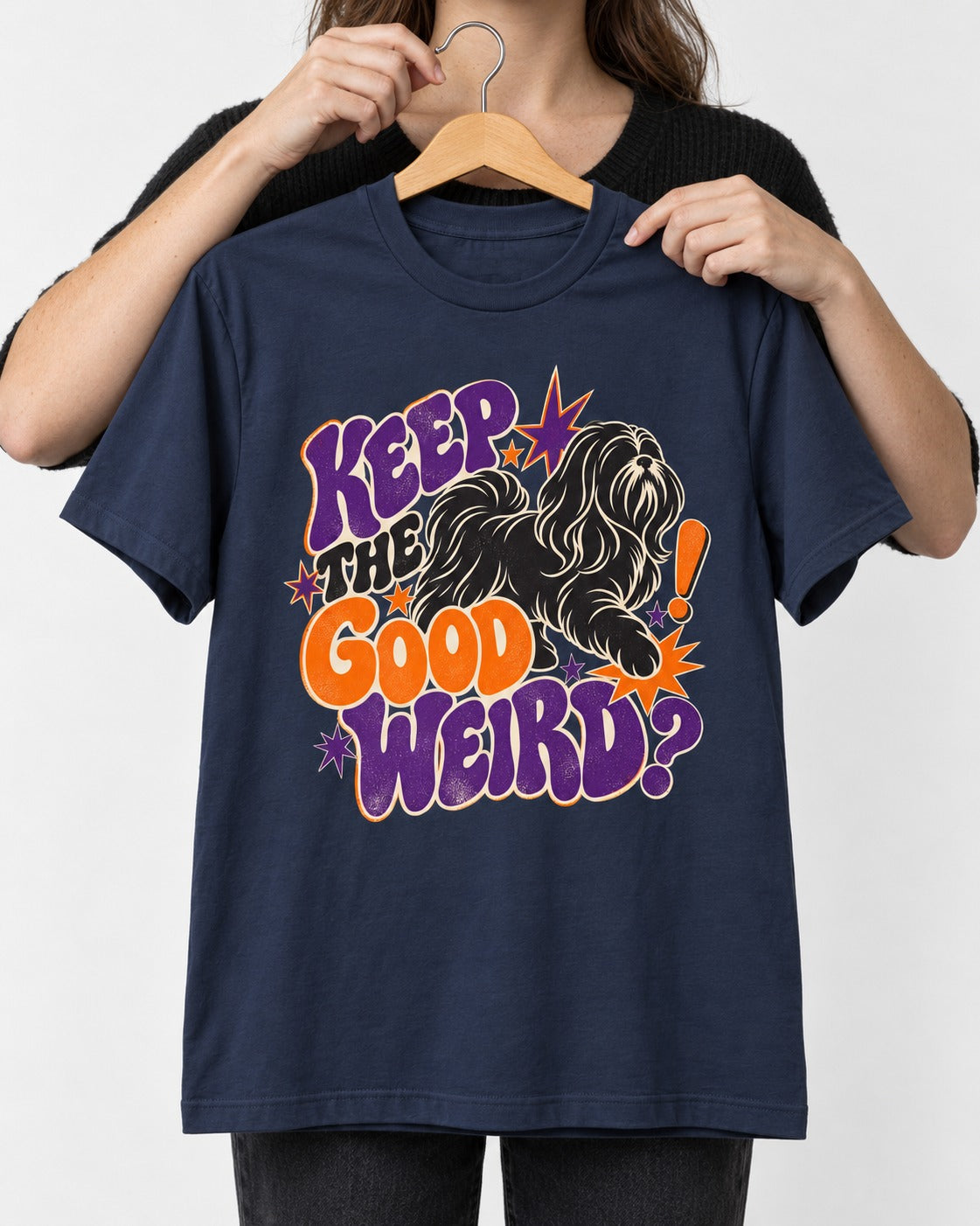 Shih Tzu Keep the Good Weird Retro Typography Graphic T-Shirt in Navy, held up on a hanger