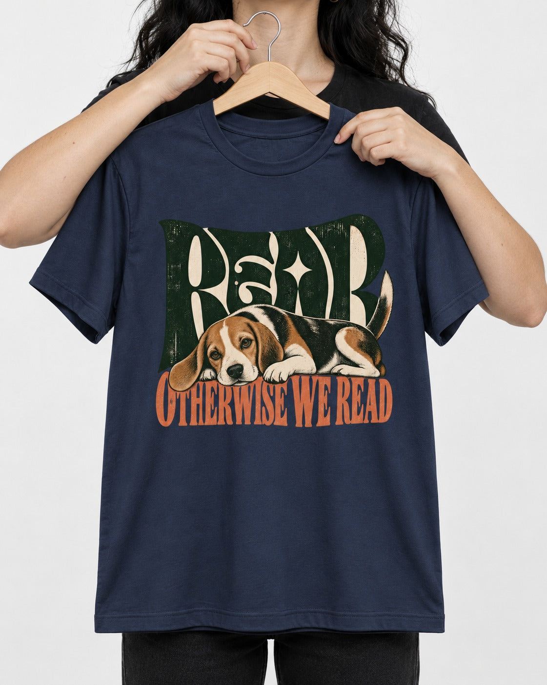 Beagle Read Otherwise We Read Retro Graphic T-Shirt in Navy, held up on a hanger