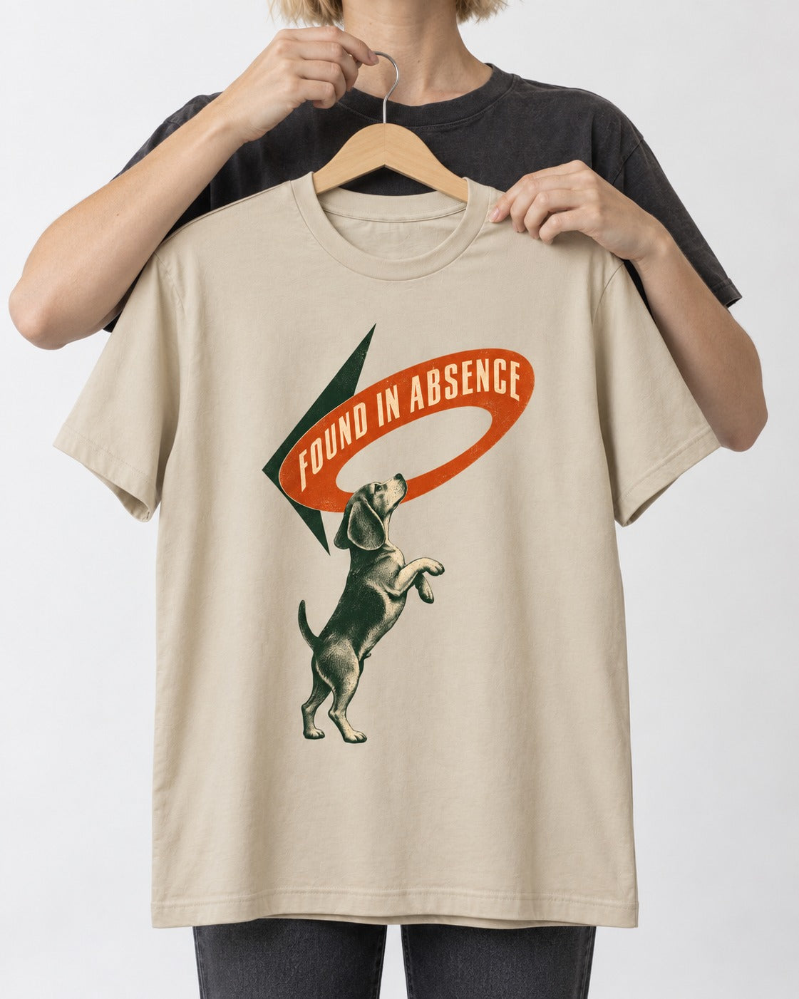 Beagle Found in Absence T-Shirt in Sand, held up on a hanger