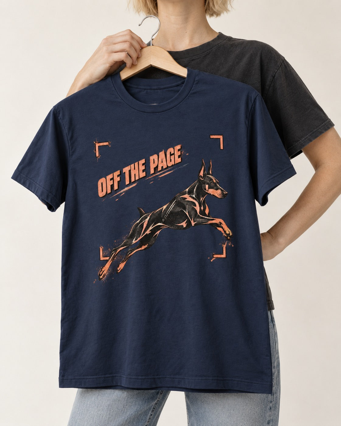 Doberman Off the Page Focus Frame Graphic T-Shirt in Navy, held up on a hanger