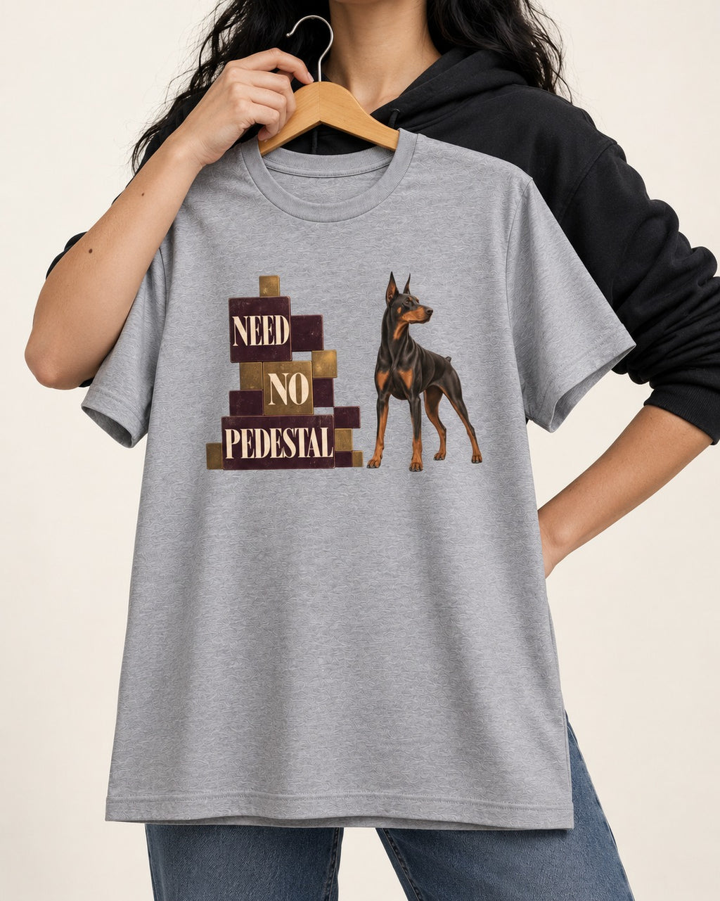 Doberman Need No Pedestal T-Shirt in Sport Grey, held up on a hanger