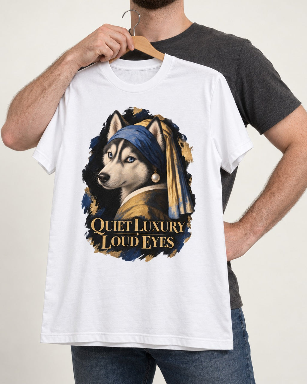 Husky Quiet Luxury Loud Eyes Pearl Portrait Graphic T-Shirt in White, held up on a hanger