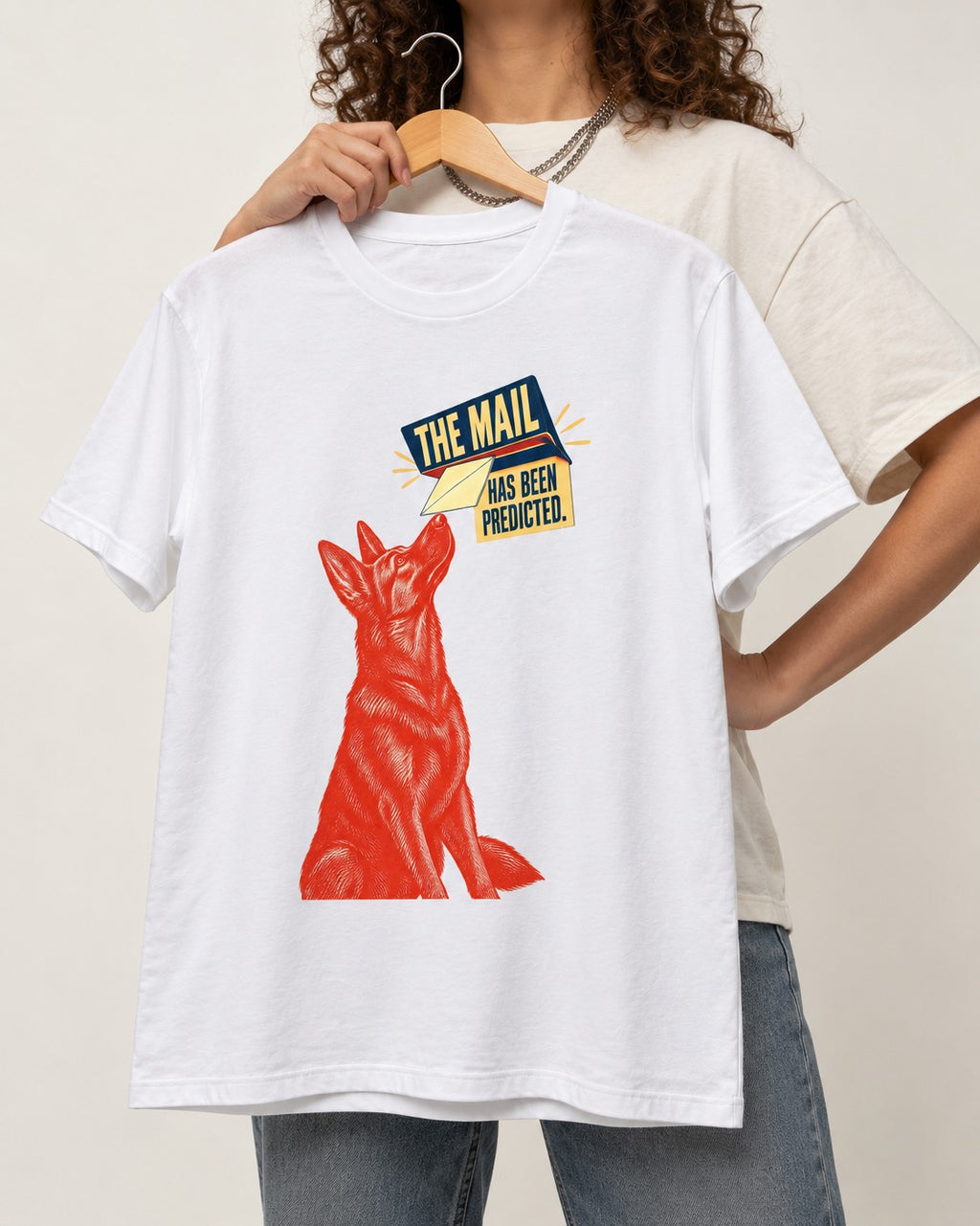 German Shepherd Dog Mail Predicted Graphic T-Shirt in White, held up on a hanger