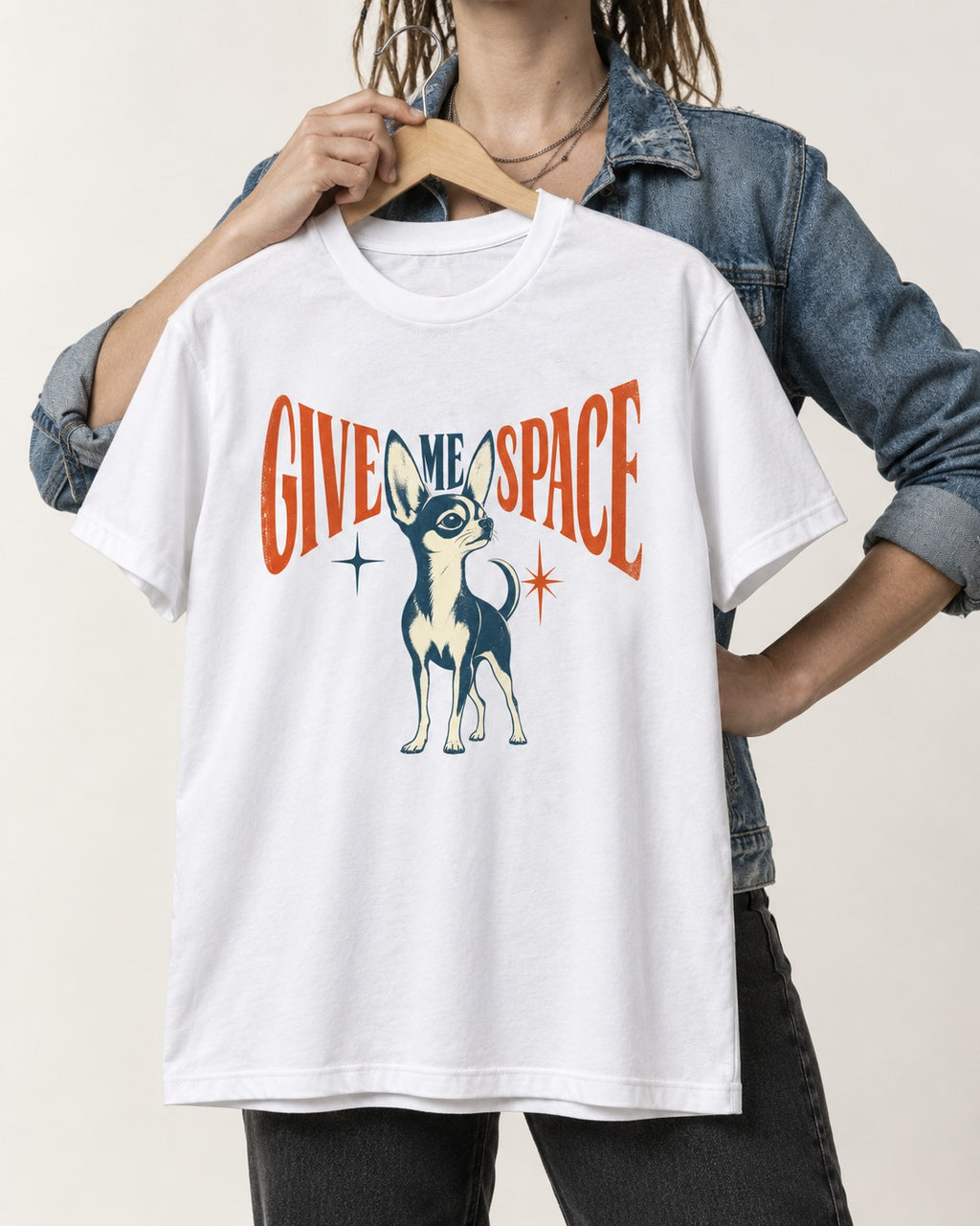Chihuahua Give Me Space Starburst Graphic T-Shirt in White, held up on a hanger