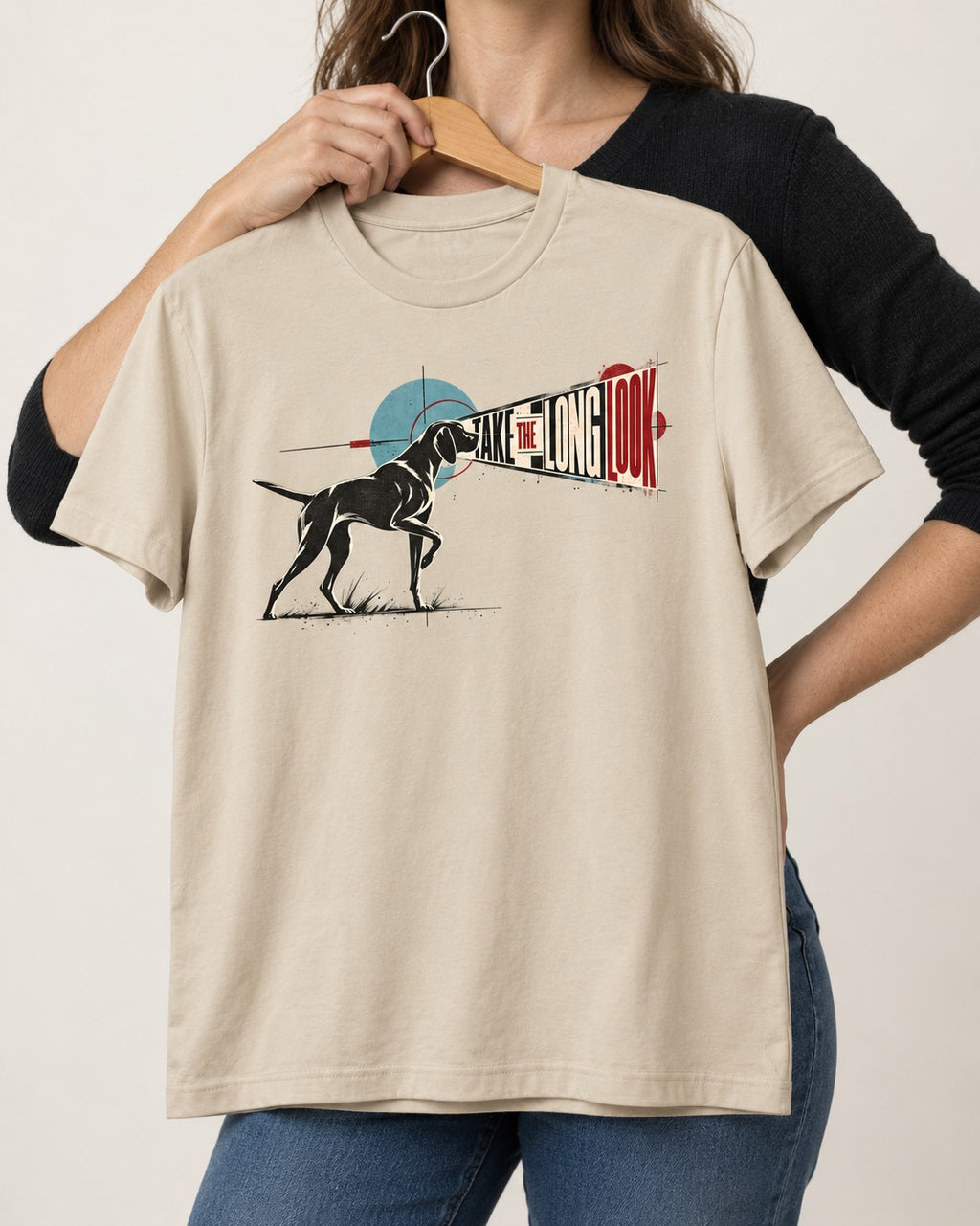 German Shorthaired Pointer Take the Long Look T-Shirt in Sand, held up on a hanger