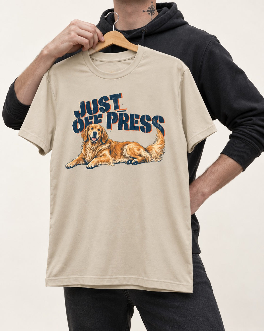 Golden Retriever Just Off Press T-Shirt in Sand, held up on a hanger