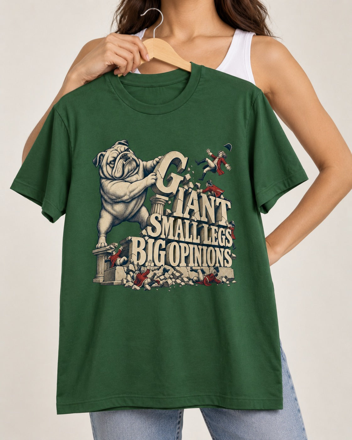 English Bulldog Giant Small Legs Big Opinions Monument Graphic T-Shirt in Forest Green, held up on a hanger