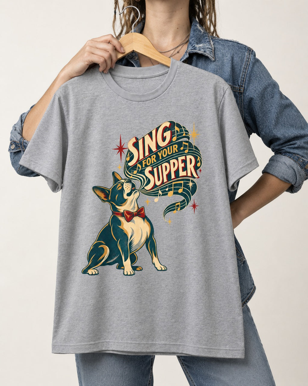 Boston Terrier Sing for Your Supper T-Shirt in Sport Grey, held up on a hanger