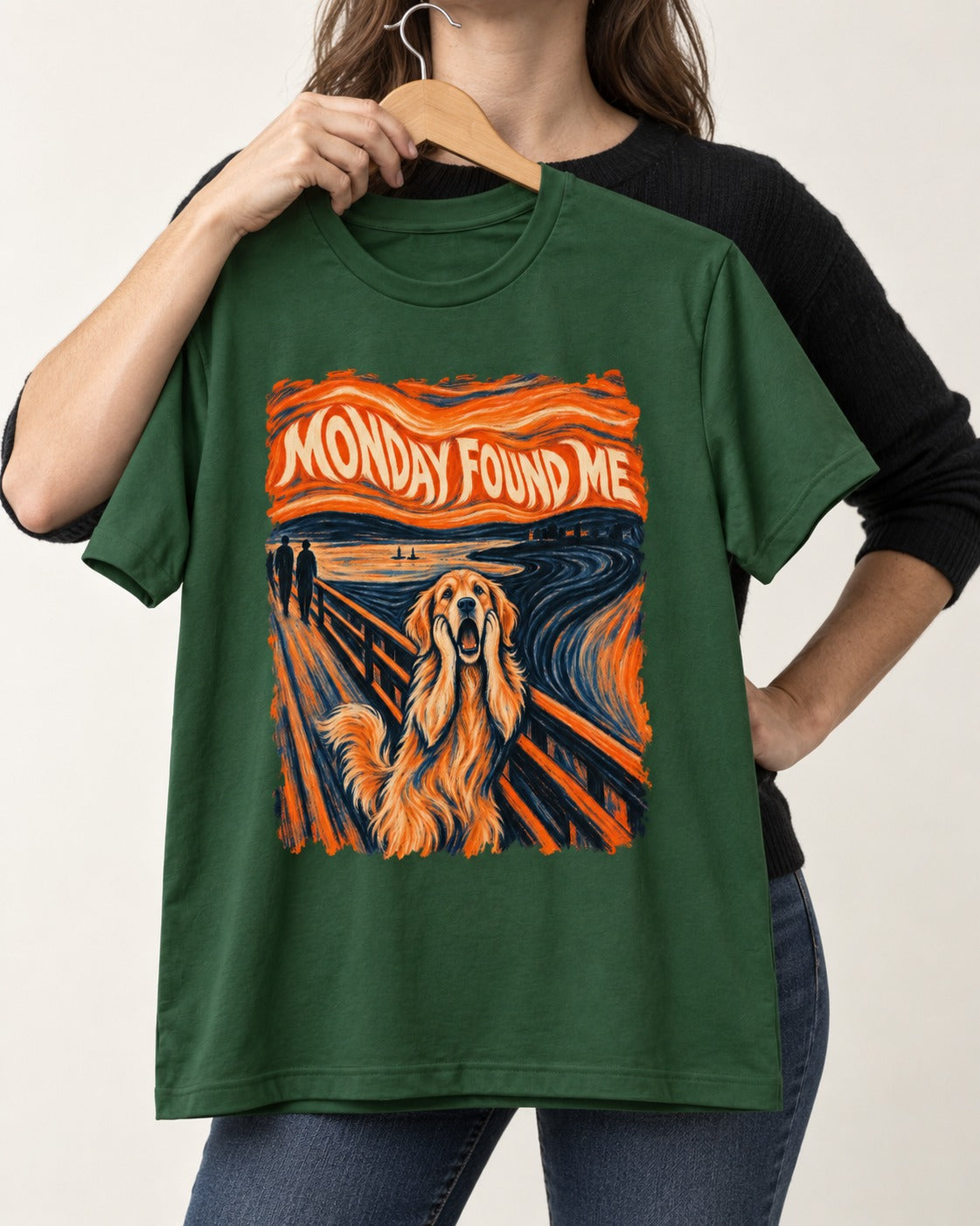 Monday Found Me Scream Golden Retriever Graphic T-Shirt in Forest Green, held up on a hanger