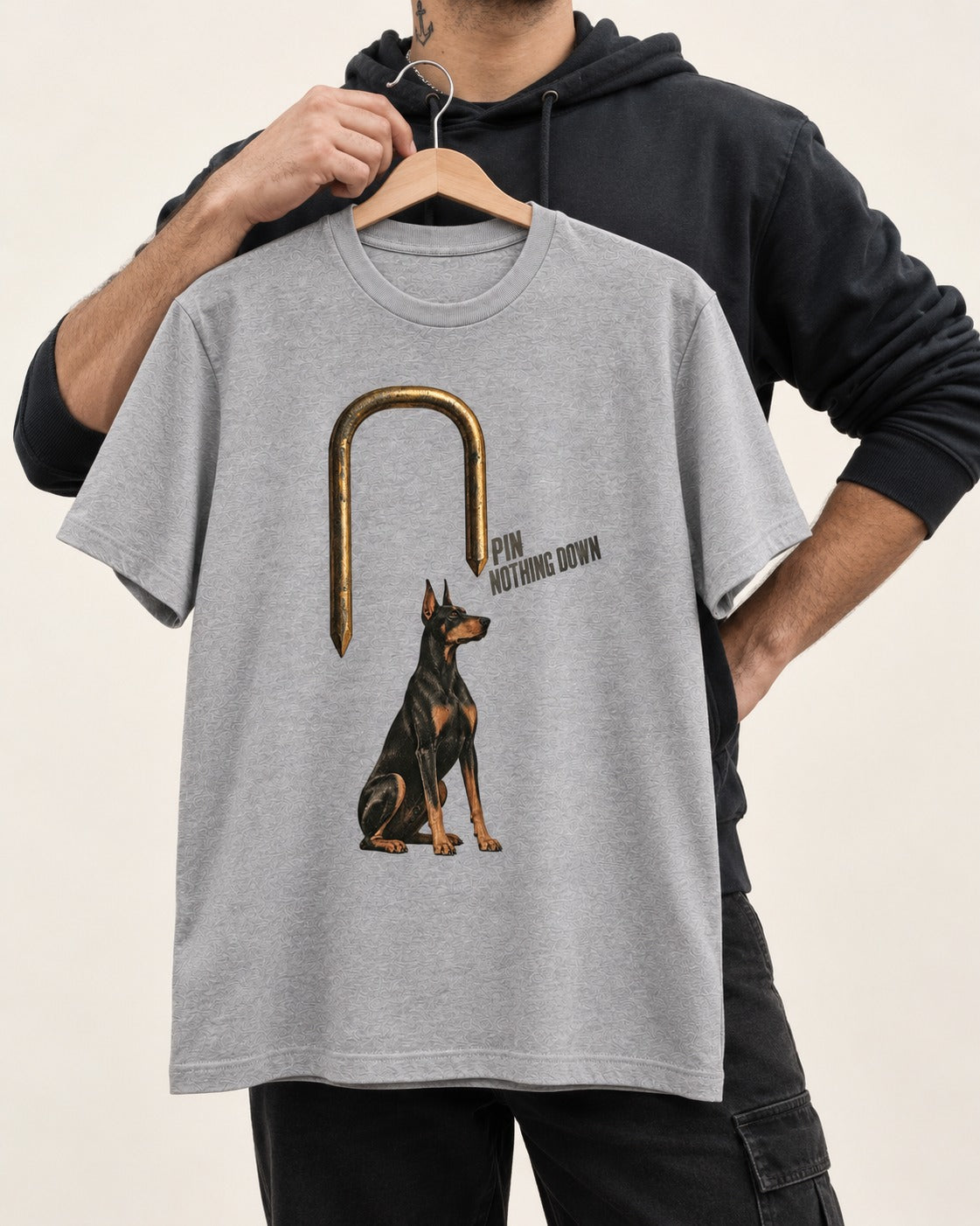 Nothing Pins Doberman Down T-Shirt in Sport Grey, held up on a hanger