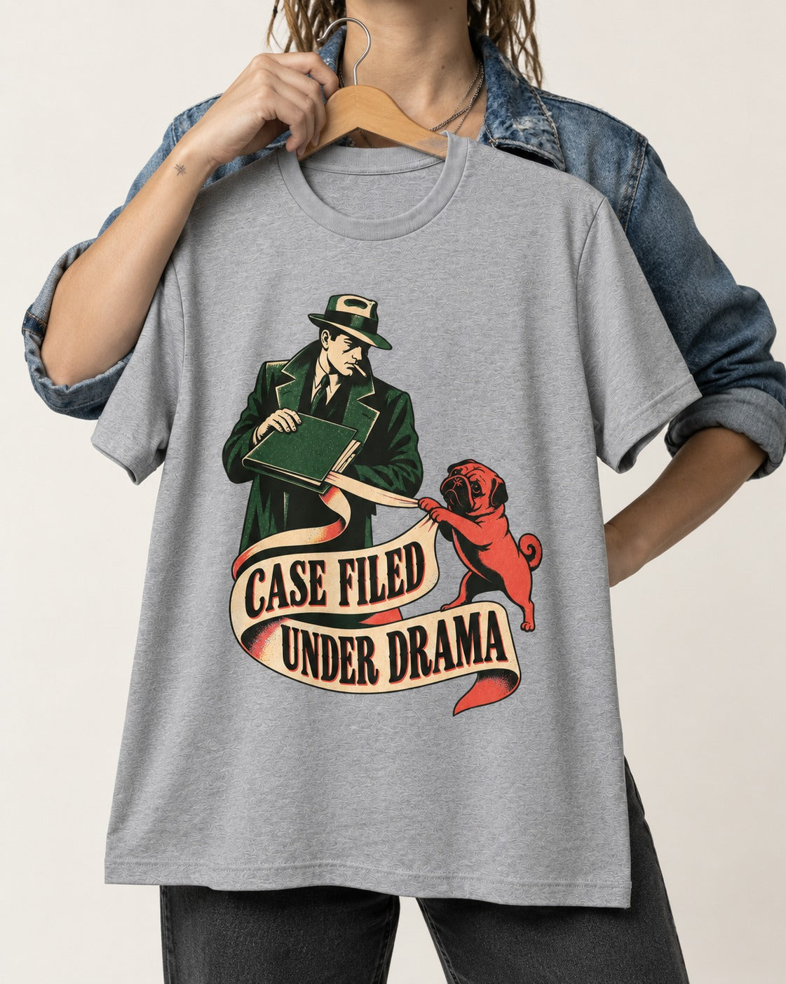 Pug Case Filed Under Drama T-Shirt in Sport Grey, held up on a hanger