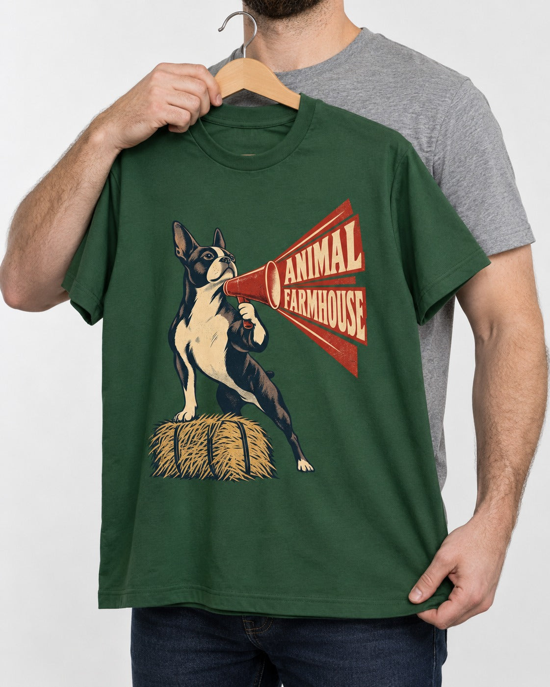 Animal Farmhouse Boston Terrier T-Shirt in Forest Green, held up on a hanger