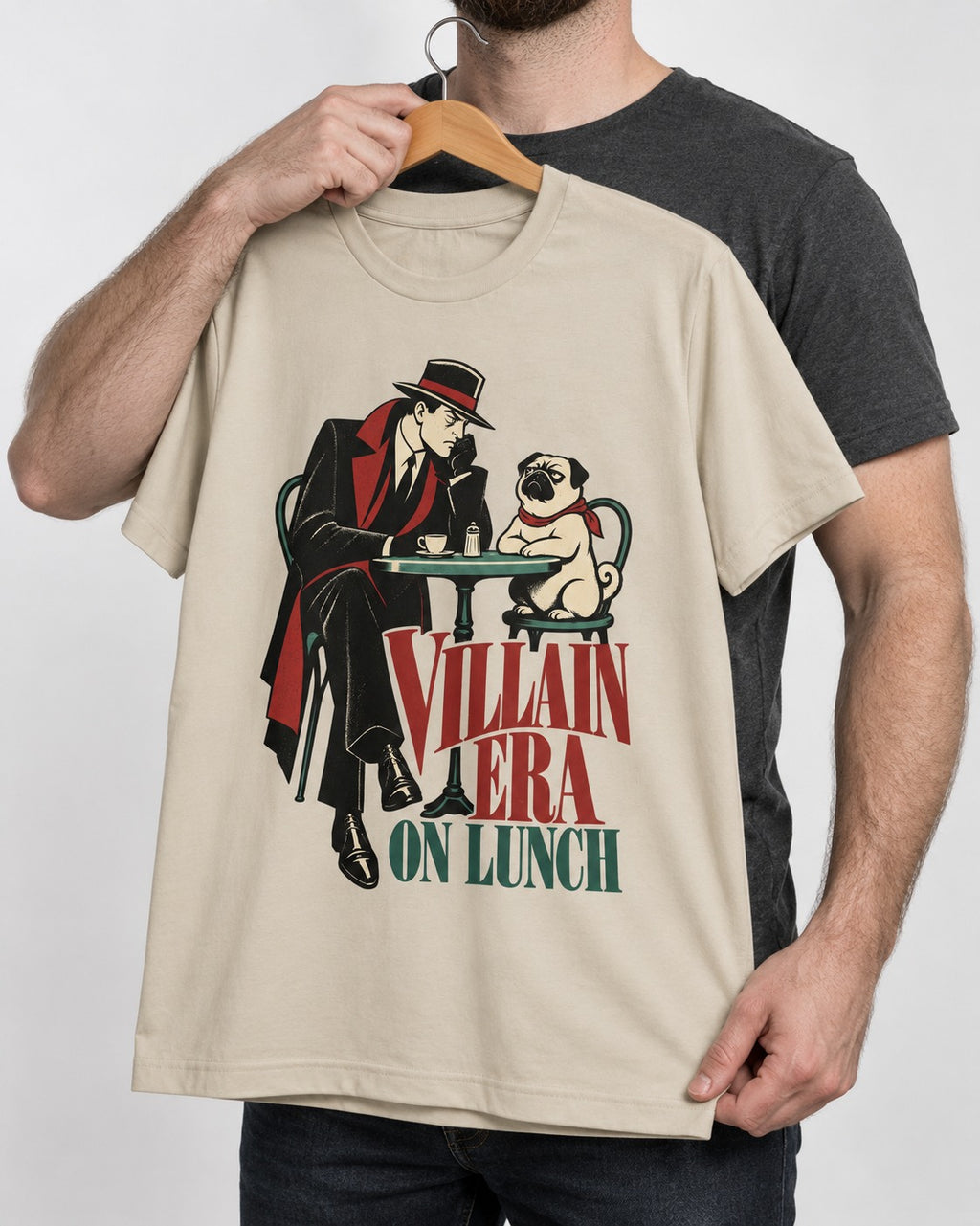 Pug Villain Era T-Shirt in Sand, held up on a hanger