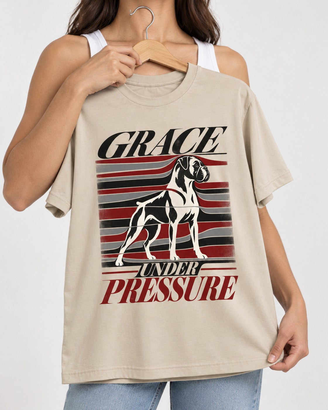 Boxer Grace Under Pressure T-Shirt in Sand, held up on a hanger