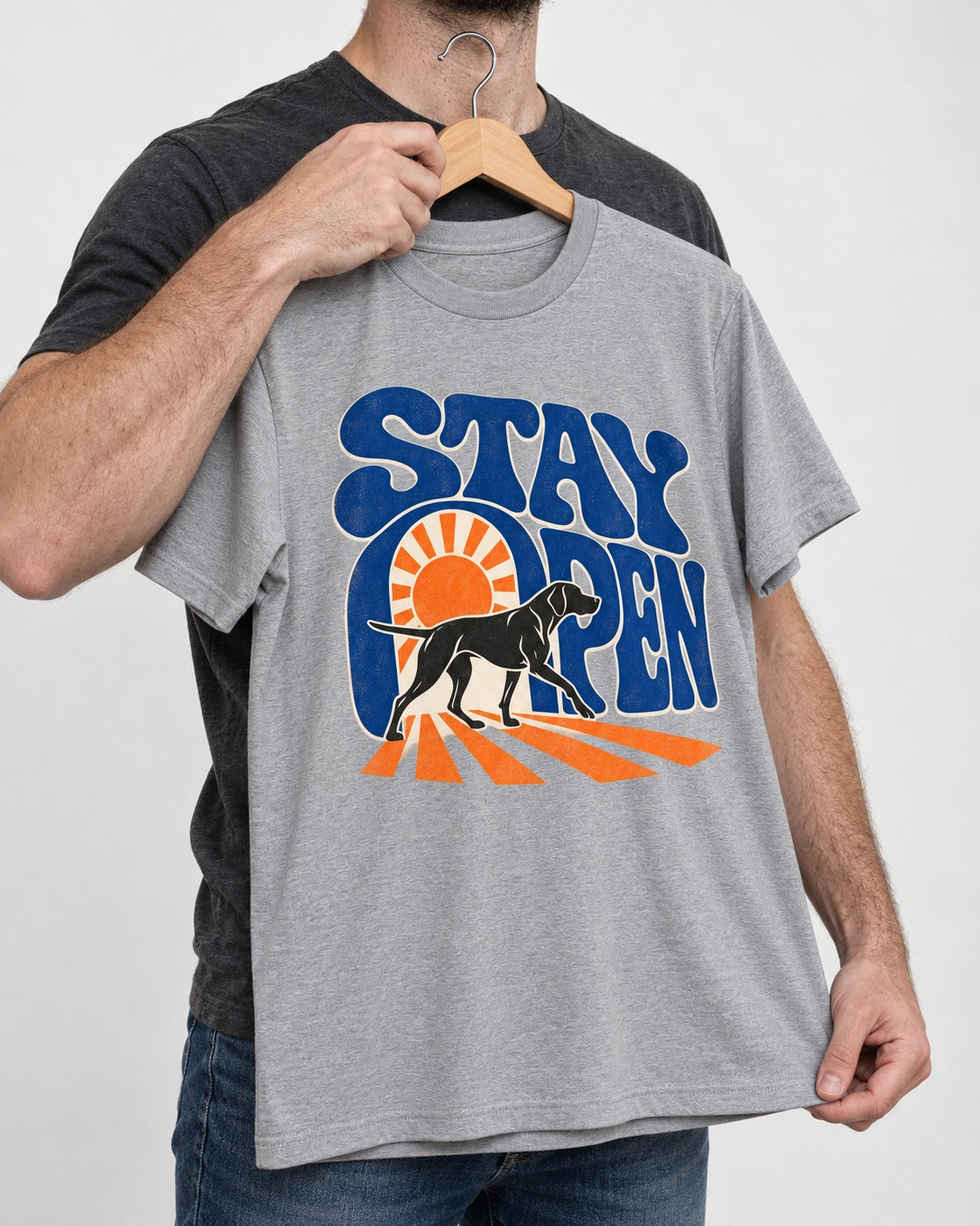 Stay Open German Shorthaired Pointer T-Shirt in Sport Grey, held up on a hanger