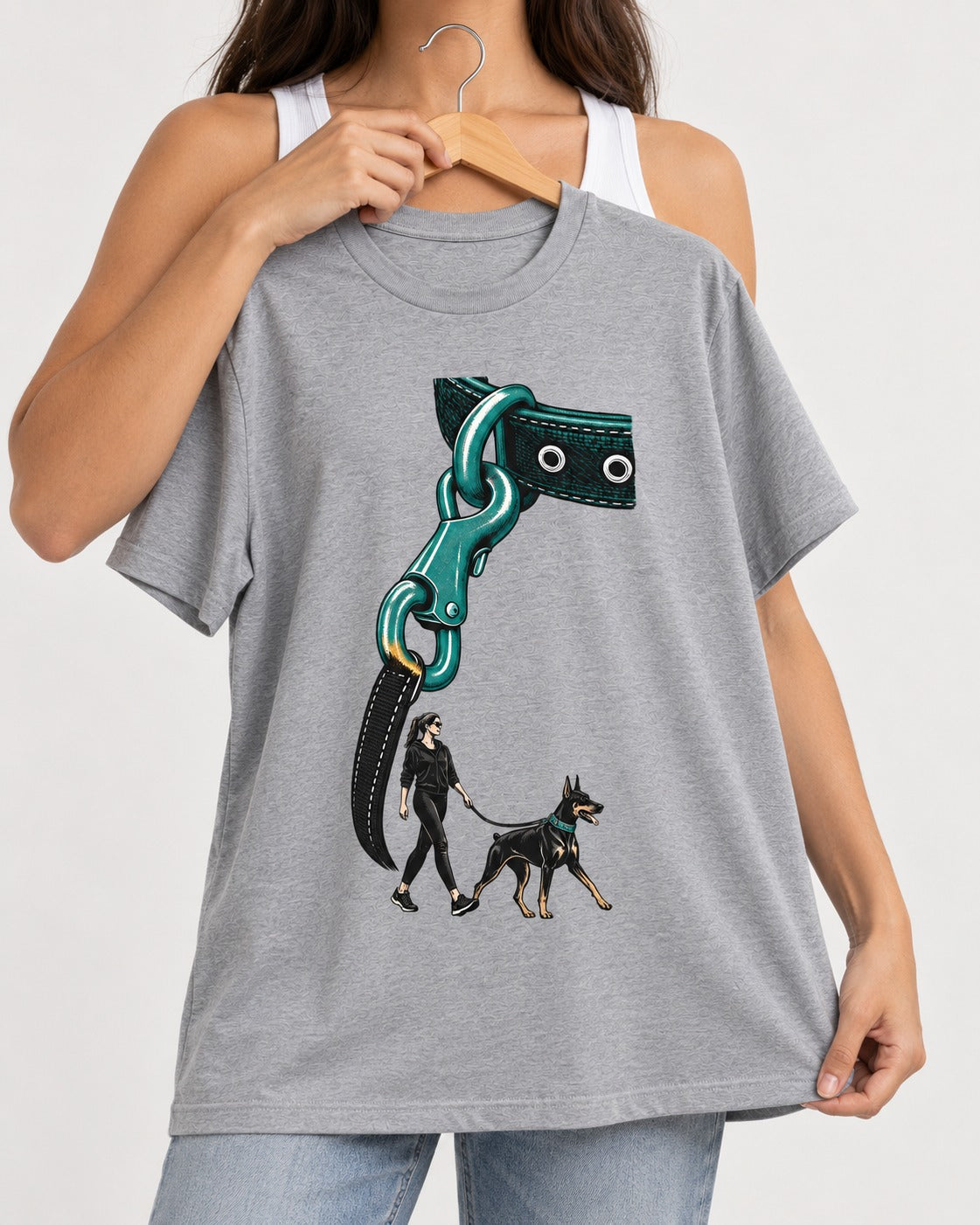 Doberman Oversized Leash Hardware Walk Graphic T-Shirt in Sport Grey, held up on a hanger